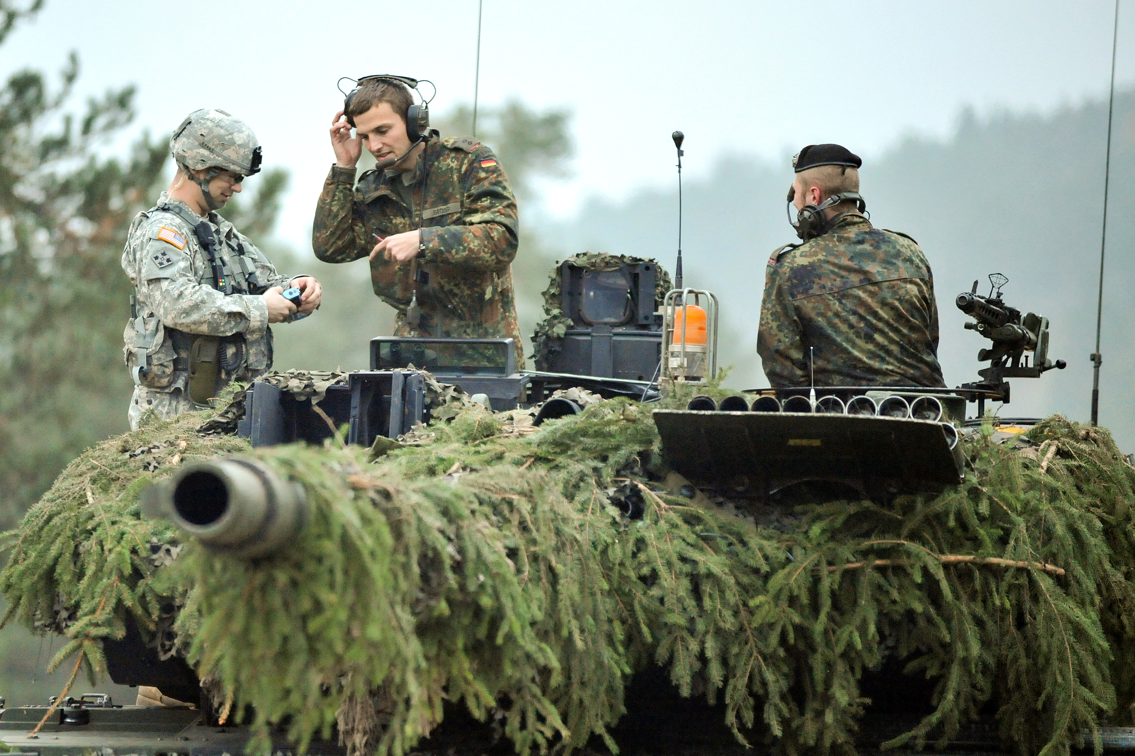 The Commander Of A German Army Leopard 2 Tank Talks To A