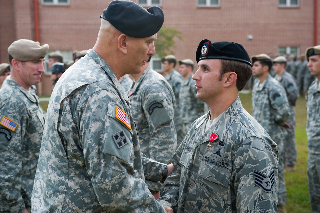 Army Chief of Staff Gen. Ray Odierno, right, presents a Bronze Star ...