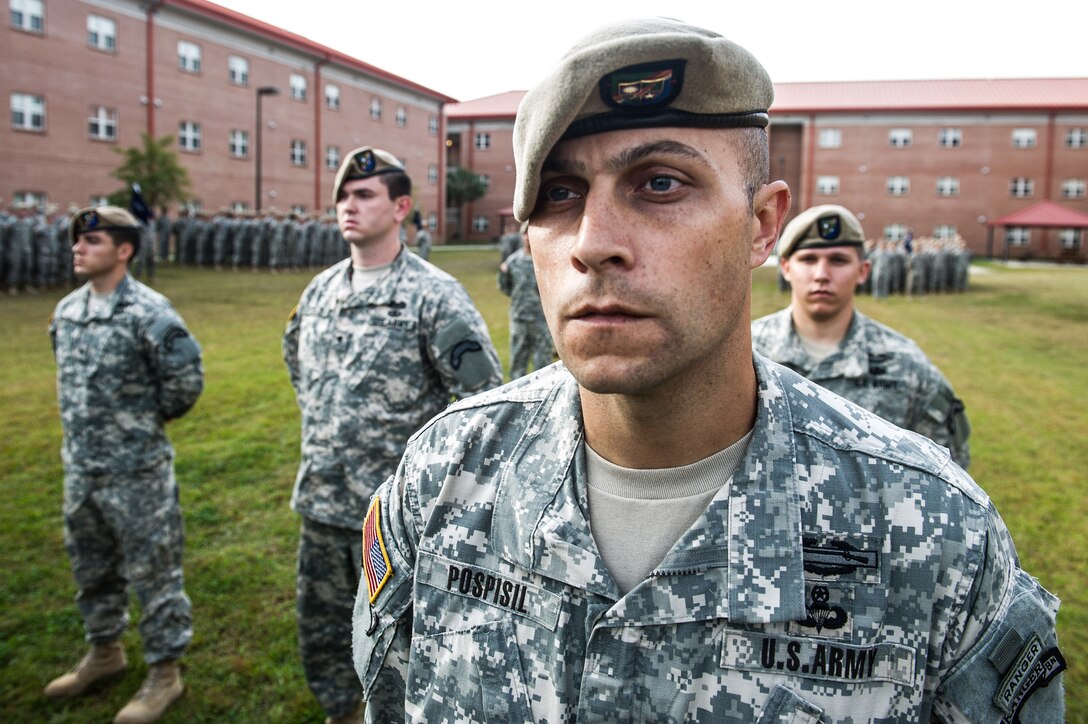 Army 1st Sgt. Quint Pospisil and other soldiers stand in formation during an award ceremony hosted by Army Chief of Staff Gen. Ray Odierno on Hunter Army Airfield, Ga., Oct. 26, 2012. Pospisil received an Army Commendation medal with V device for valor for his actions during combat operations in Afghanistan. The soldiers are assigned to the 1st Battalion, 75th Ranger Regiment.