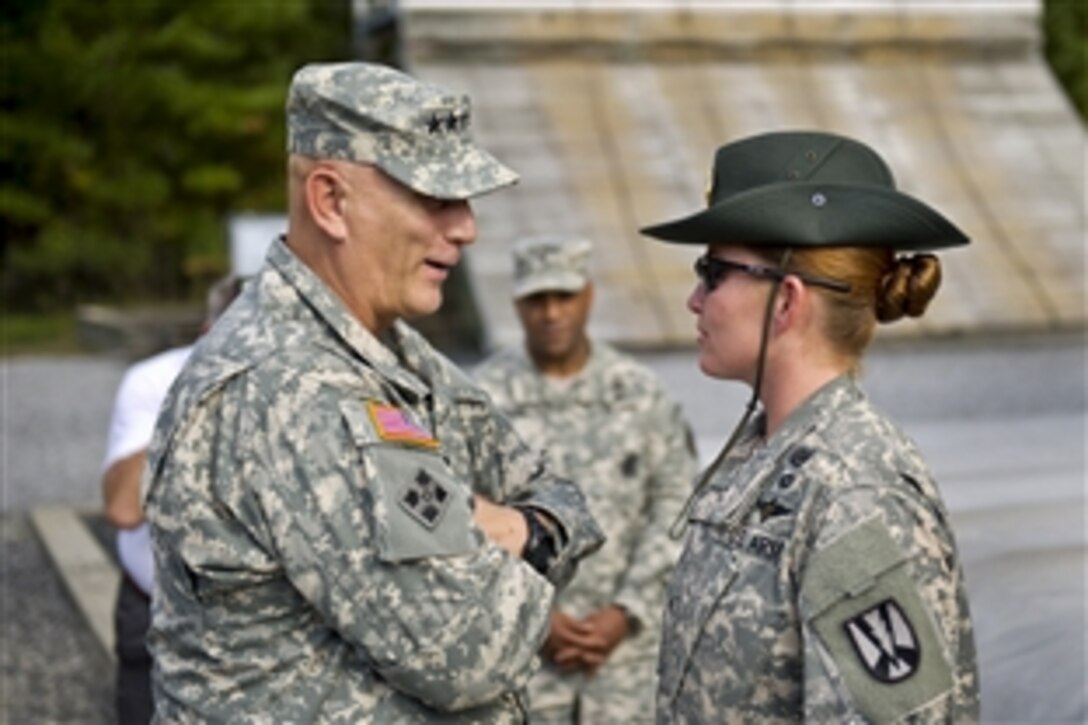 Army Chief of Staff Gen. Ray Odierno, left, speaks to Sgt. Serina Glass as he visits basic facilities on Fort Jackson, S.C., Oct. 25, 2012. 