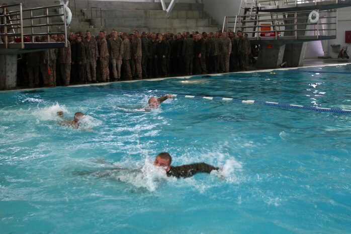 Recruits of Company I, 3rd Recruit Training Battalion, swim to safety after properly conducting a dive aboard Marine Corps Recruit Depot San Diego, Oct. 22. If recruits showed poor technique during their dive, instructors had recruits do it again. All techniques learned were part of a water survival course that all recruits must pass to graduate boot camp.