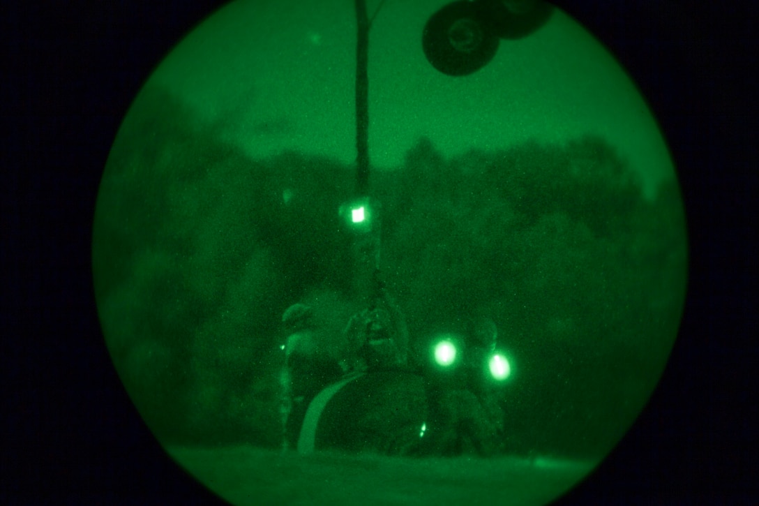 Marines assigned to Combat Logistics Battalion (CLB) 26, 26th Marine Expeditionary Unit (MEU), connect a 500 gallon water tank to an Osprey during helicopter suspension training at Camp Lejeune, N.C., Oct. 23, 2012. The exercise was supported by an MV-22B Osprey assigned to Marine Medium Tiltrotor Squadron (VMM) 266 Reinforced, 26th Marine Expeditionary Unit (MEU). This training is part of the 26th MEU’s pre-deployment training program, which is slated to deploy in 2013.