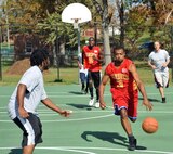 Dominic Hunter, Marine Corps Systems Command (MCSC) Vipers Basketball Team player, tries to take advantage of a fast break against the Quantico Town All-Stars during the 2012 One-Day Basketball Tournament at the Town of Quantico’s Municipal Park on Saturday. MCSC was crowned the champions after beating the All-Stars and Mocosos. 