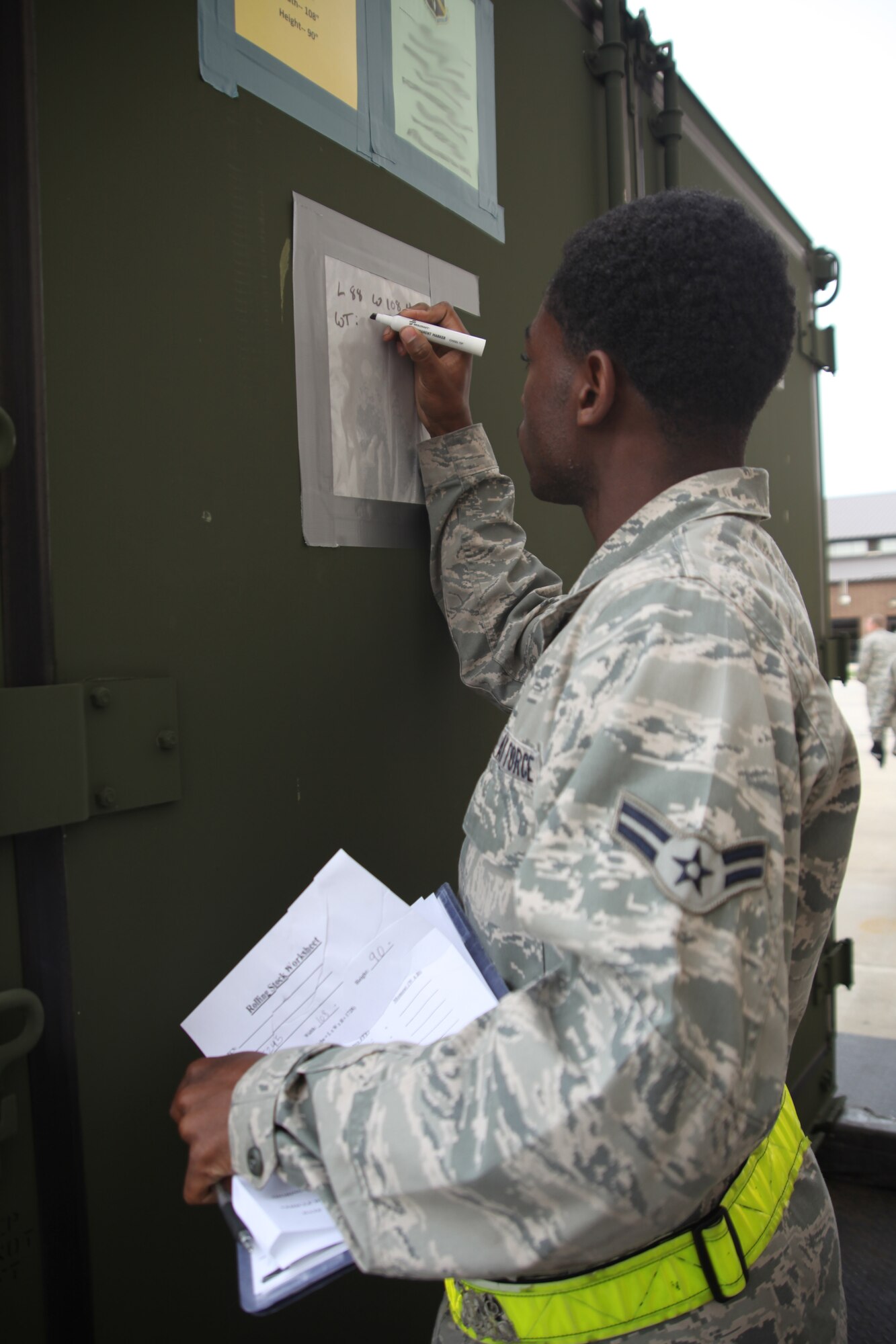 Airman 1st Class Marquis Cole, 305th Aerial Port Squadron air transportation specialist, from Independence, La., annotates correct height and weight onto an increment, or cargo item, Oct. 27, 2012, at Joint Base McGuire-Dix-Lakehurst, N.J. This information is critical to ensure aircraft personnel know exactly how much weight is on an aircraft. Gear and vehicles were weighed and measured to prepare them for transport before the arrival of Hurricane Sandy.

(U.S. Air Force photo by 2nd Lt. David J. Murphy/Released)