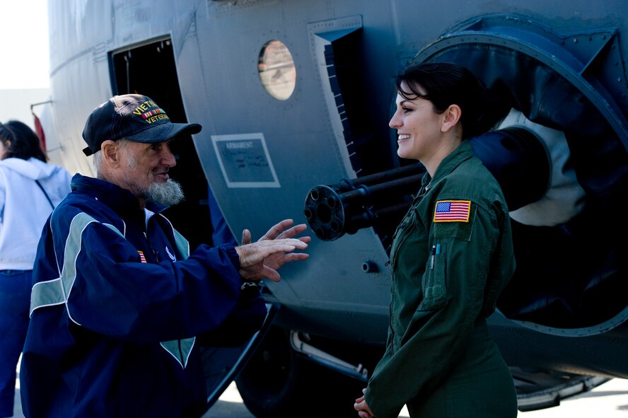 Senior Airman Kathleen Eliseo, a sensor operator of the 4th Special Operations Squadron, and Clayton Lyon, a retired Tech. Sgt., discuss the AC-130U during Hurlburt Field’s Open House at the flightline at Hurlburt Field, Fla., Oct. 27, 2012. Team Hurlburt’s Open House gave the public an inside look at the 1st Special Operations Wing and some of the other units located at Hurlburt Field. Ground displays of several types of Special Operations aircraft including the AC-130U Spooky Gunship and the CV-22 Osprey, as well as various other types of specialized military equipment from across base were featured. (U.S. Air Force Photo/Airman 1st Class Hayden K. Hyatt)