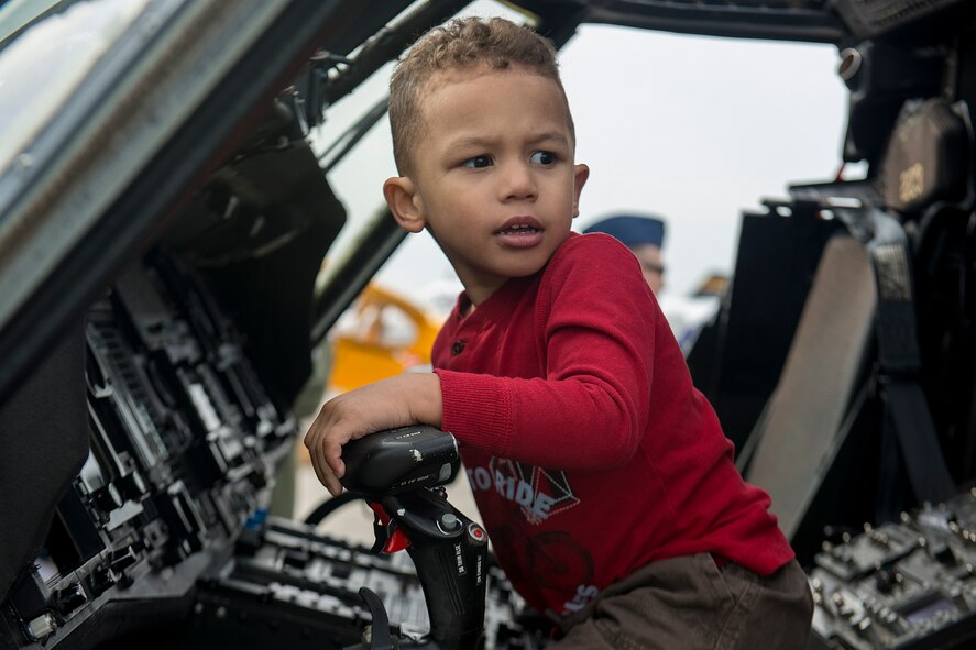 Three-year-old Amari Butler, son of U.S. Air Force Staff Sgt. Kenneth Butler, 23d Operations Support Squadron airfield management, sits in the cockpit of an HH-60G Pave Hawk helicopter during the Moody Air Force Base, Ga., Legacy of Liberty Open House air show Oct. 27, 2012. In addition to aerial acts, the air show featured static aircraft, which gave guests a chance to get an up-close view of air power. (U.S. Air Force photo by Staff Sgt. Jamal D. Sutter/Released) 