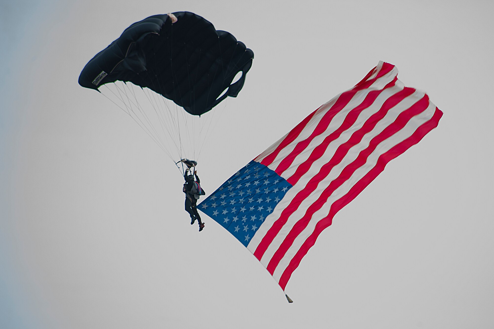 A member of the Special Forces Association Parachute Jump Team makes his way to a landing zone during the Moody Air Force Base, Ga., Legacy of Liberty Open House air show Oct. 27, 2012. The team performed as an Airman sang the national anthem. (U.S. Air Force photo by Staff Sgt. Jamal D. Sutter/Released) 