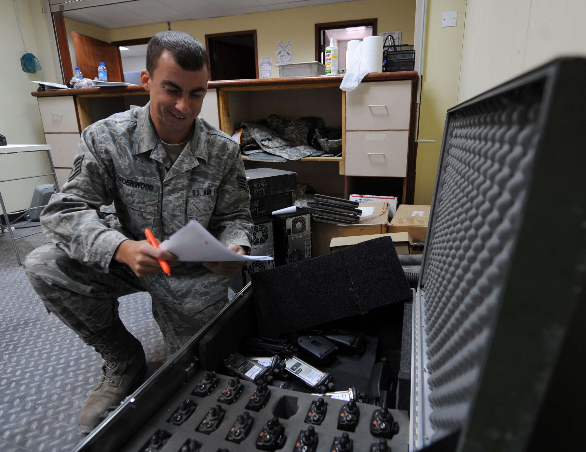 SOUTHWEST ASIA – Staff Sgt. Jeremy Underwood, 386th Expeditionary Communication Squadron base equipment custodian officer, takes inventory on land mobile radios here Oct. 20. As the base equipment custodian, Underwood maintains a $20M fixed asset property account with 100 percent oversight of 160 sub-accounts of inventorial assets. Underwood also provides customer support and communicational support to base personnel, by issuing computers, monitors, cell phones and LMRs that directly support the flying mission. Underwood is the 386th Air Expeditionary Wing rock solid warrior. (U.S. Air Force photo/Staff Sgt. Alexandra M. Boutte)