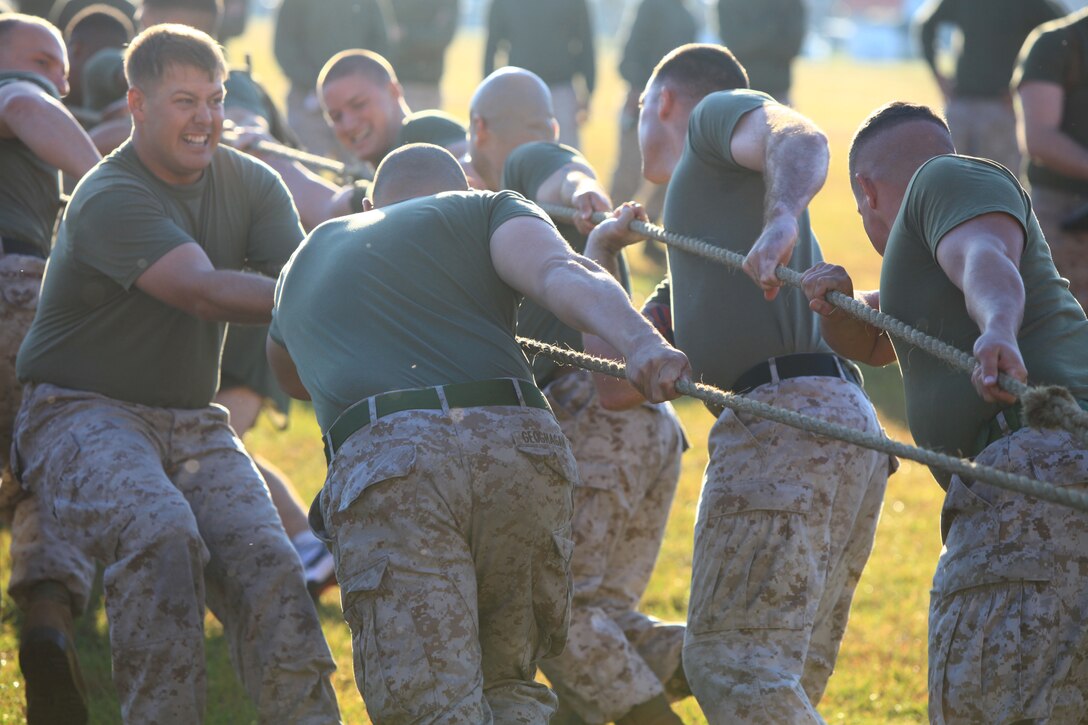 Marines with 2nd Maintenance Battalion, 2nd Marine Logistics Group strain against the weight of a seven-ton truck as they haul the vehicle during the unit’s field meet aboard Camp Lejeune, N.C., Oct. 24, 2012. The battalion used the competition as a focal point to build camaraderie and test its Marines’ endurance over the course of several events. 