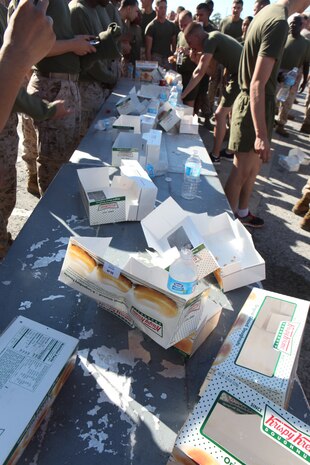 The chaotic mess from the doughnut-eating competition held during 2nd Maintenance Battalion, 2nd Marine Logistics Group’s field meet aboard Camp Lejeune, N.C., clutters a table Oct. 24, 2012. Participants volunteered to eat twelve doughnuts and run a total of three miles during the challenge, which left doughnut debris strewn around their starting point.