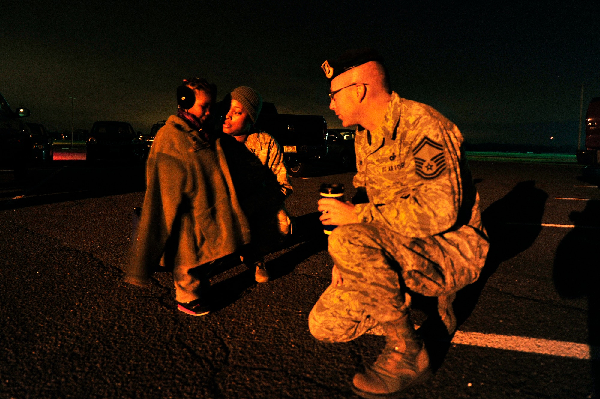 JOINT BASE MCGUIRE-DIX-LAKEHURST, N.J. –  U.S. Air Force  Staff Sgt. Quileighqua Tolbert-Coleman, an airfield manager assigned to the 621st Contingency Response Wing at Joint Base McGuire-Dix-Lakehurst, N.J. says goodbye to her daughter, three-year-old Deameriah Winters, while Deameriah’s temporary caretaker, Senior Master Sgt. Joe Barden, 818th Global Mobility Readiness Squadron superintendent, watches Oct. 28, 2012.  She was being deployed to MacDill Air Force Base, Fla. ahead of the path of Hurricane Sandy. Tolbert-Coleman’s husband was out of town at a funeral when Hurricane Sandy forced the deployment of her contingency response team to meet Air Mobility Command requirements.   (U.S. Air Force photo by Tech. Sgt.  Parker Gyokeres) (Released) 