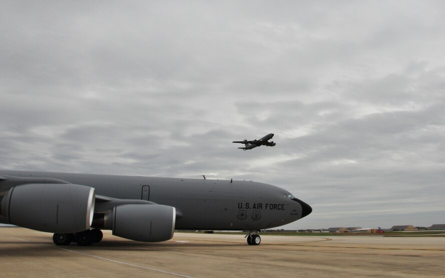 A KC-135 Stratotanker from the 459th Air Refueling Wing, takes off as another one taxis onto the runway, in preparation of Hurricane Sandy, at Joint Base Andrews, Md., Oct.28, 2012. The planes were evacuated to a location away from any affects of the storm as to protect these valuable national assets. (U.S. Air Force photo/ Senior Airman Katie Spencer)