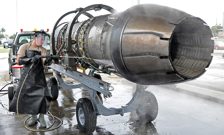 Senior Airman Andres Acosta, 482nd Maintenance Squadron aerospace propulsion, pressure washes an F-16 jet engine at Homestead Air Reserve Base, Fla., Oct. 25. All jet engines are cleaned with environmentally friendly degreaser and pressure washed prior to going to the engine shop. (U.S. Air Force photo/Senior Airman Jacob Jimenez)   