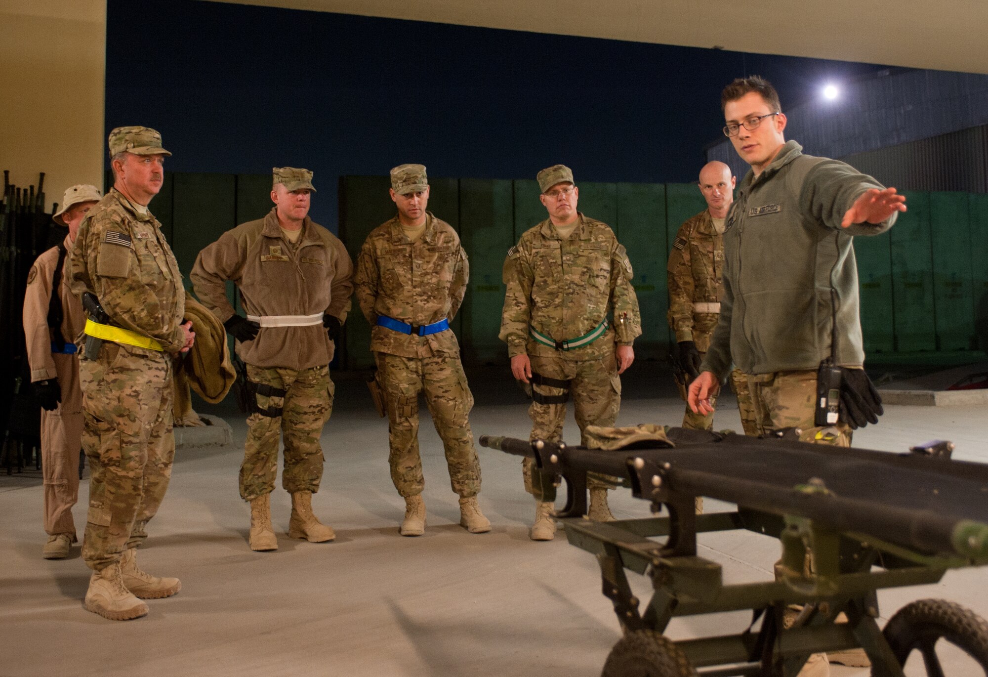 U.S. Air Force Airman 1st Class Robert DeSantis (right), a medical technician assigned to the Craig Joint Theater Hospital, gives instructions to a group of 1st Sergeants at the Contingency Aeromedical Staging Facility at Bagram Airfield, Afghanistan, Oct. 27, 2012. BAF’s 1st Sergeants volunteered together at the Contingency Aeromedical Staging Facility to help transport wounded servicemembers from CJTH to receive continued medical care. (U.S. Air Force Photo/Staff Sgt. Jeff Nevison)