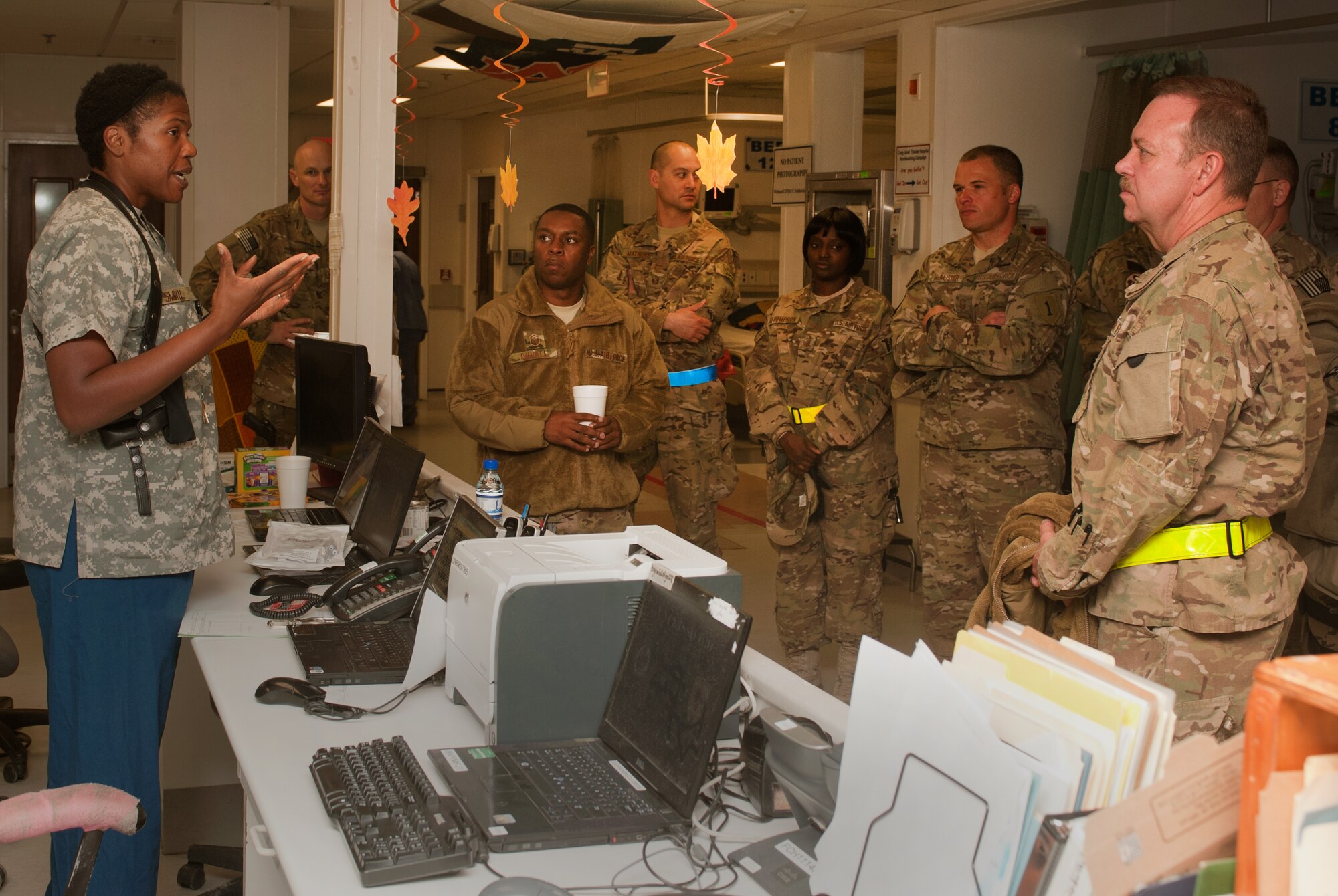 U.S. Air Force Maj. Erika Smith (left), an Intensive Care Unit nurse assigned to the 455th Expeditionary Medical Operations Squadron at the Craig Joint Theater Hospital, explains specific ICU procedures to a group of 1st Sergeants at Bagram Airfield, Afghanistan, Oct. 27, 2012. BAF’s 1st Sergeants volunteered together at the Contingency Aeromedical Staging Facility to help transport wounded servicemembers from CJTH to receive continued medical care. (U.S. Air Force Photo/Staff Sgt. Jeff Nevison)