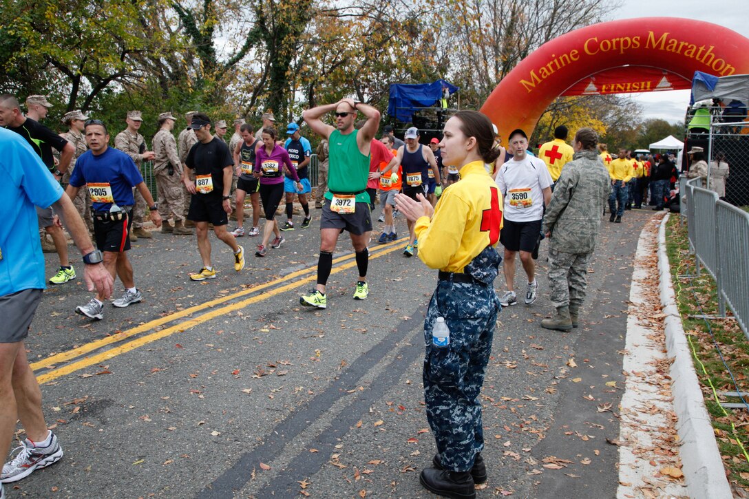 Navy corpsmen wait nearby for runners with injuries or illnesses at the finish line of the 37th Marine Corps Marathon Oct. 28. Medical stations manned by civilian and military practitioners were set up throughout the 26.2-mile course.