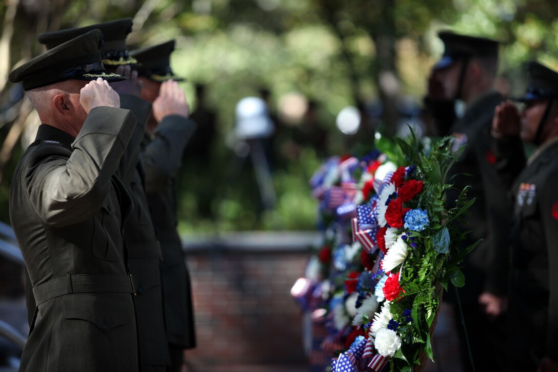Marines salute wreaths being laid in remembrance of the service members who lost their lives in the Beirut bombing during the Beirut Memorial Service Ceremony in Jacksonville, N.C., Oct. 23. There were three wreaths laid at the event: one to honor the connection between the Jacksonville and Marine Corps Base Camp Lejeune communities, one to pay respect to the Marines and sailors who died during the attack and were a part of the community, and one representing the Marines of 1st Battalion, 8th Marine Regiment, 2nd Marine Division, of which many of the fallen Marines belonged to.