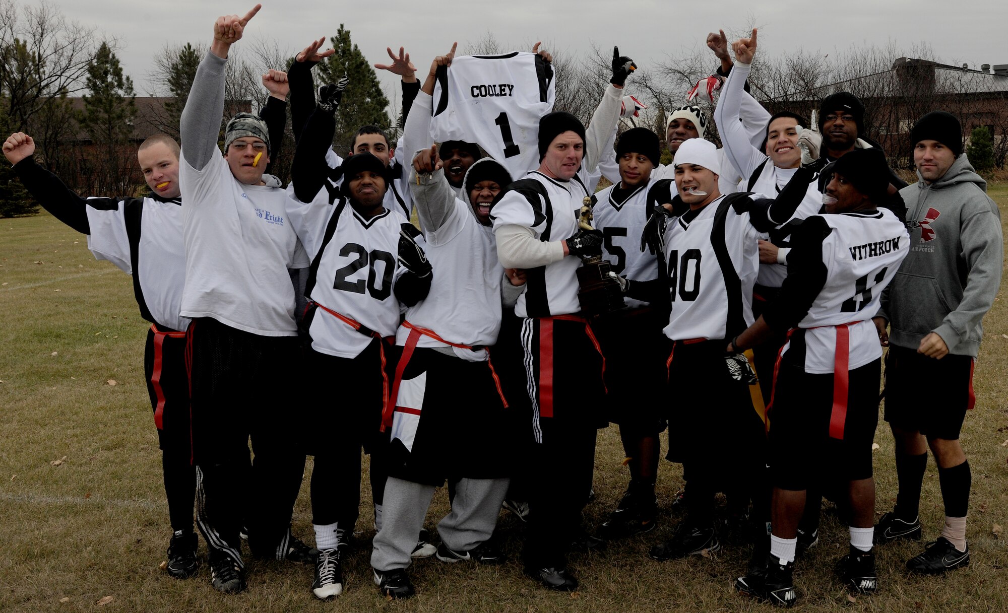 Members of the 319th Security Forces Squadron’s intramural flag football team celebrate their championship victory Oct. 27, 2012, on Grand Forks Air Force Base, N.D. The 319th SFS defeated the 319th CES by a score of 19-6. (U.S Air Force photo/Airman 1st Class Derek VanHorn)