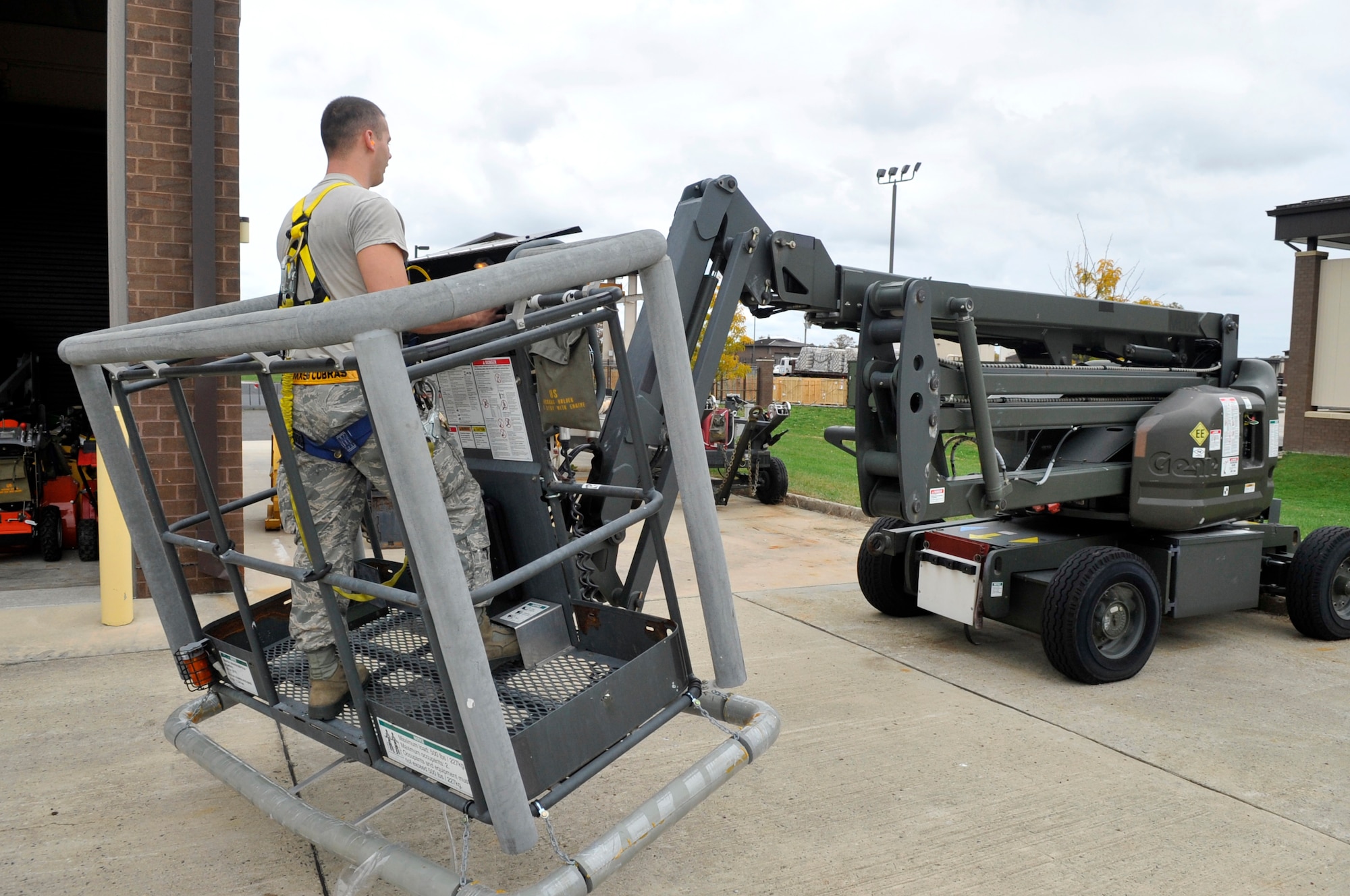 Staff Sgt. Jason Alan, 305th Maintenance Squadron aerospace ground equipment mechanic, moves equipment that can normally be stored outside into a hangar Oct. 26, 2012 here. Alan hails from Stockbridge, Ga.  (U.S. Air Force photo by Wayne Russell/Released)