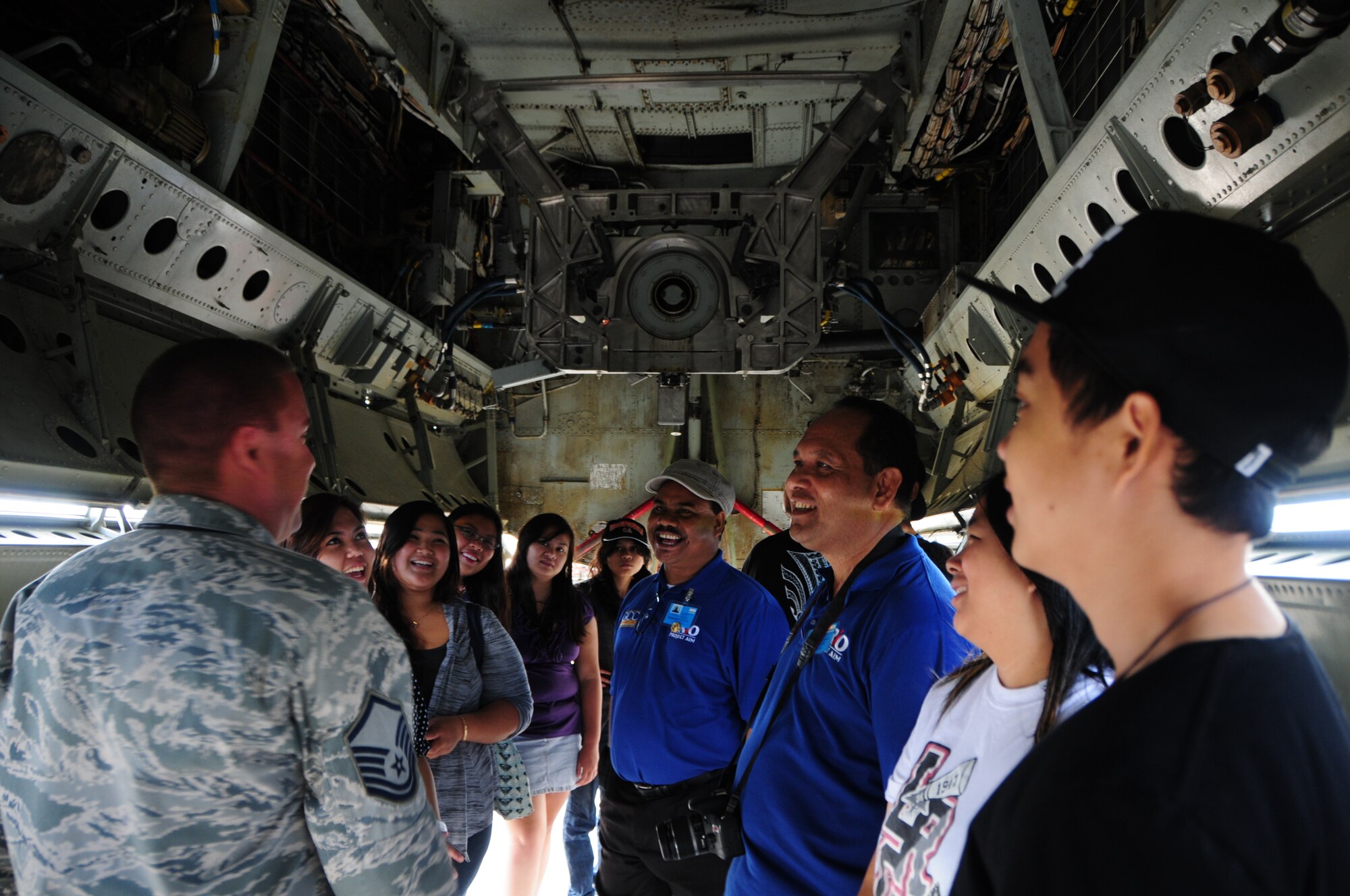 ANDERSEN AIR FORCE BASE, Guam – Master Sgt. Timothy Rosenau, 36th Expeditionary Aircraft Maintenance Squadron productions supervisor,  speaks to students and chaperons from the Guam Community College about the B-52 Stratofortress history during a career advancement tour on the flightline here, Oct. 19. (U.S. Air Force photo/Airman 1st Class Marianique Santos/Released)