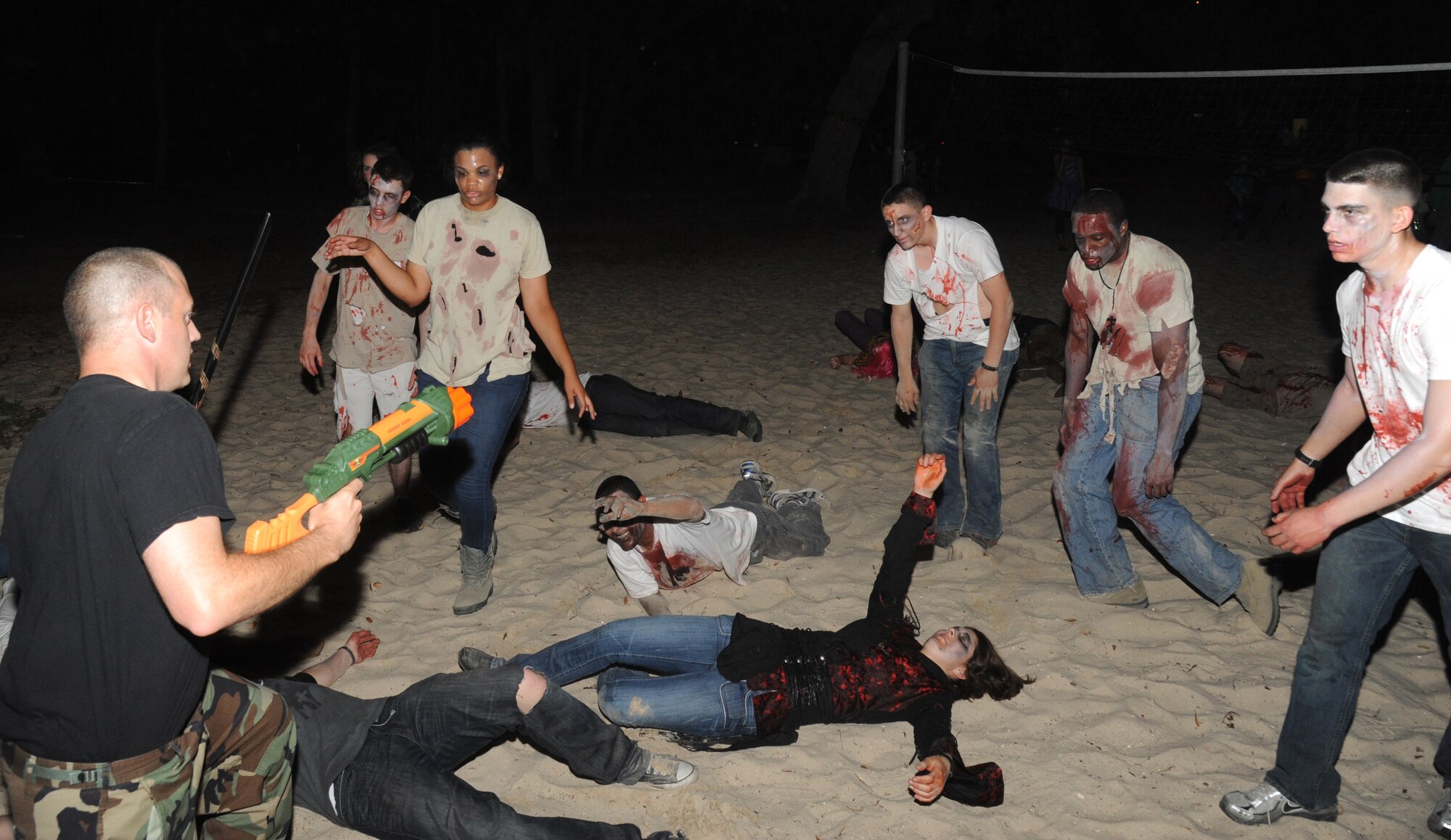 Students in the 81st Training Group, dressed up as zombies, put on a performance and dance for the audience at Ghouls in the Park Oct. 26, 2012, at the Marina Park, Keesler Air Force Base, Miss.  The event included a haunted house, trunk or treat, hay ride and music.  (U.S. Air Force photo by Kemberly Groue)