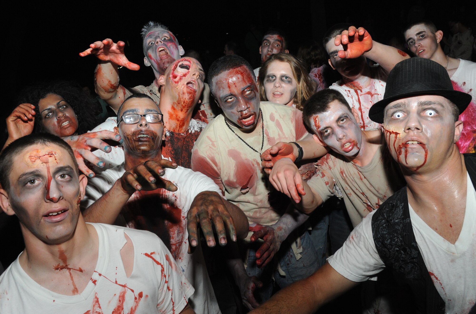 Students in the 81st Training Group, dressed up as zombies, put on a performance and dance for the audience at Ghouls in the Park Oct. 26, 2012, at the Marina Park, Keesler Air Force Base, Miss.  The event included a haunted house, trunk or treat, hay ride and music.  (U.S. Air Force photo by Kemberly Groue)