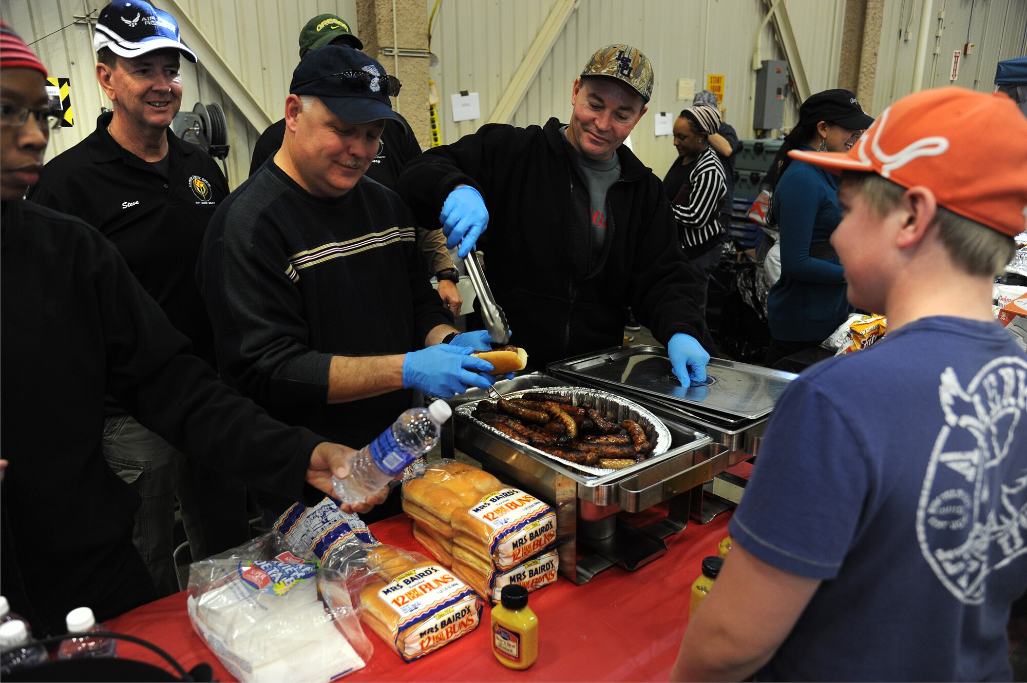 The Cannon Chiefs Group serves food during the Fall Festival at Cannon Air Force Base, N.M., Oct. 27, 2012. With games, food and a live band, this event was popular for base families as more than 500 people joined in the festivities.  (U.S. Air Force photo/Senior Airman Jette Carr)
