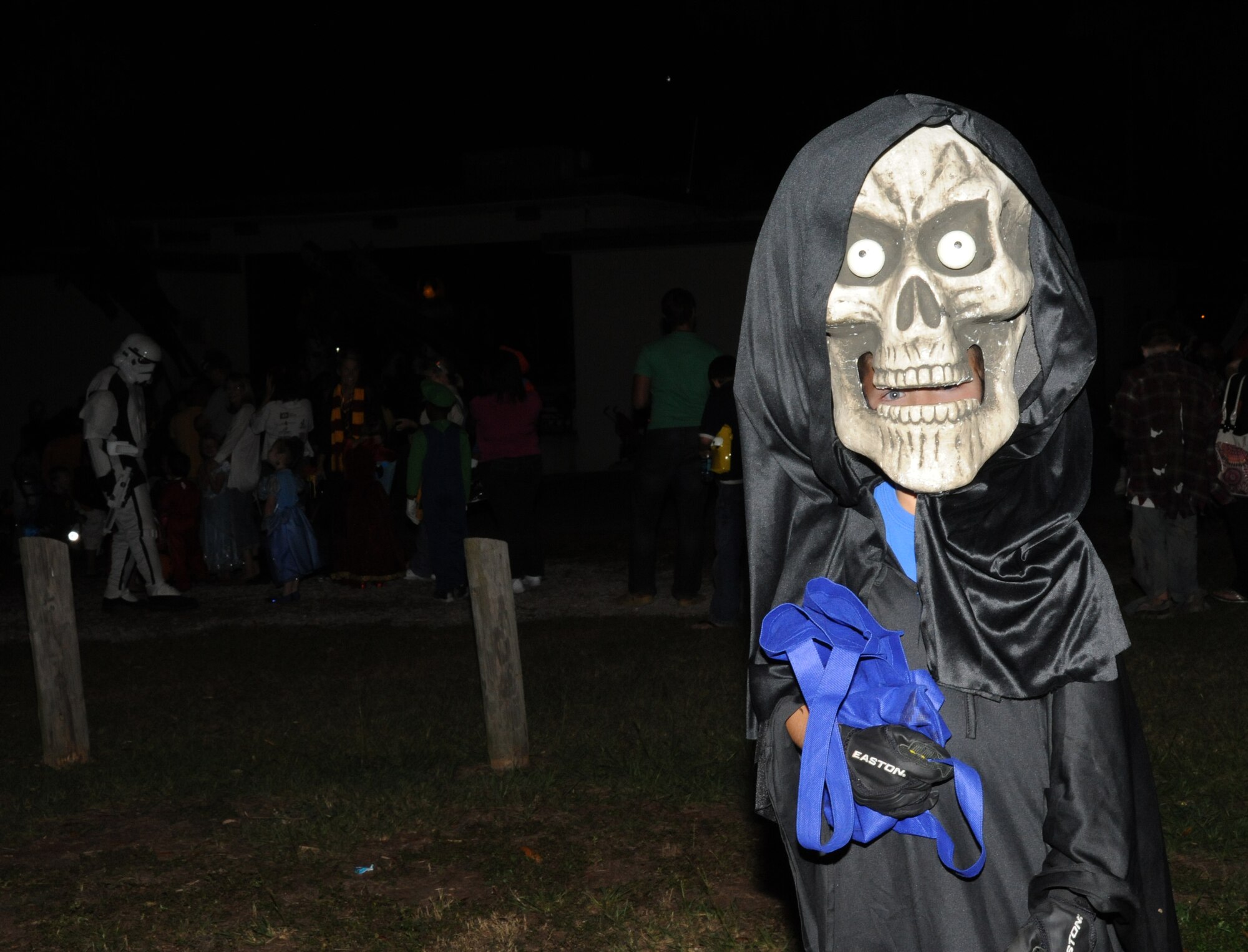 Eight-year-old Gage Angeles, dressed as the grim reaper during Ghouls in the Park Oct. 26, at the Marina Park, Keesler Air Force Base, Miss.  The event included a haunted house, trunk or treat, hay ride and music.  Gage’s parents are John and Maj. Debbie Angeles, 81st Medical Operations Squadron.  (U.S. Air Force photo by Kemberly Groue)