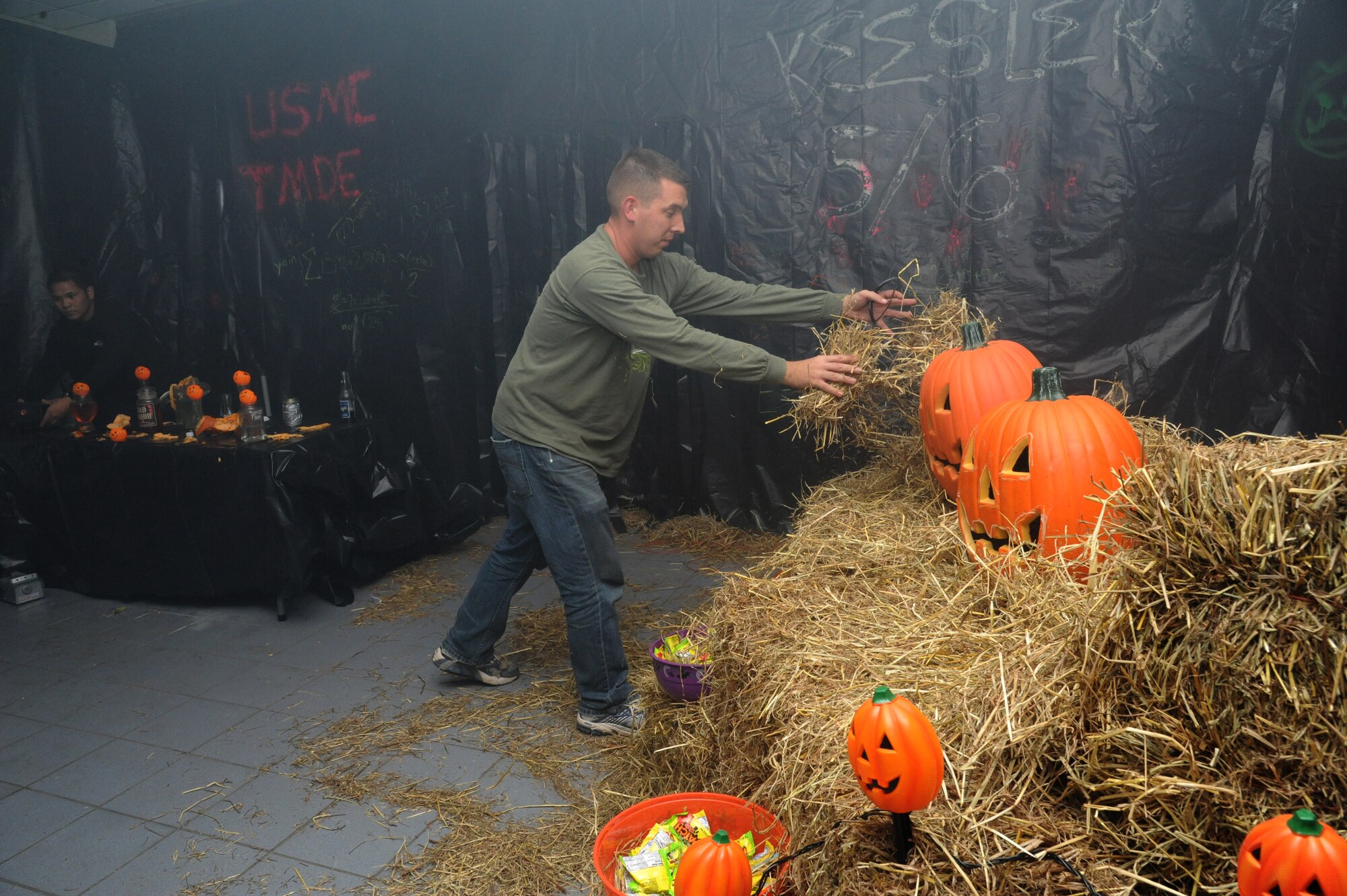 Tech. Sgt. Geoffrey Gagnon, 81st Training Support Squadron, puts finishing touches inside the haunted house at Ghouls in the Park Oct. 26, 2012, at the Marina Park, Keesler Air Force Base, Miss.  The event also included trunk or treat, hay ride and music.  (U.S. Air Force photo by Kemberly Groue)