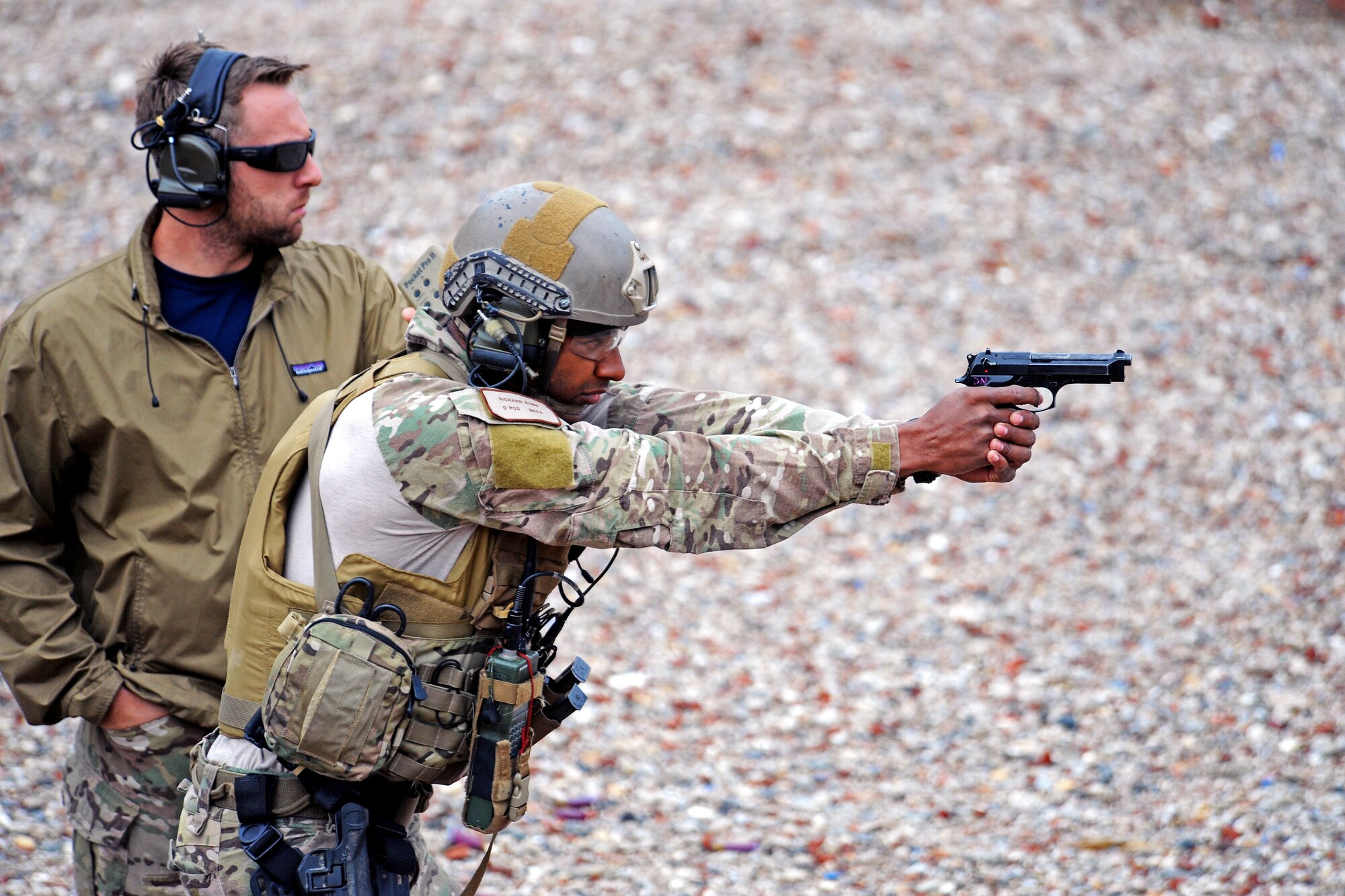 Staff Sgt. Richard Dunn a pararescueman with the 306th Rescue Sqauadron paraticpates in the pistol event of the bi-annual PJ Rodeo hosted by the hosted by the New York Air National Guard’s  106th Rescue Wing during the last week of September 2012. The 306th RQS took first place in the bi-annual PJ Rodeo. ( U.S. Air Force Photo/ Senior Airman Christopher S. Muncy)