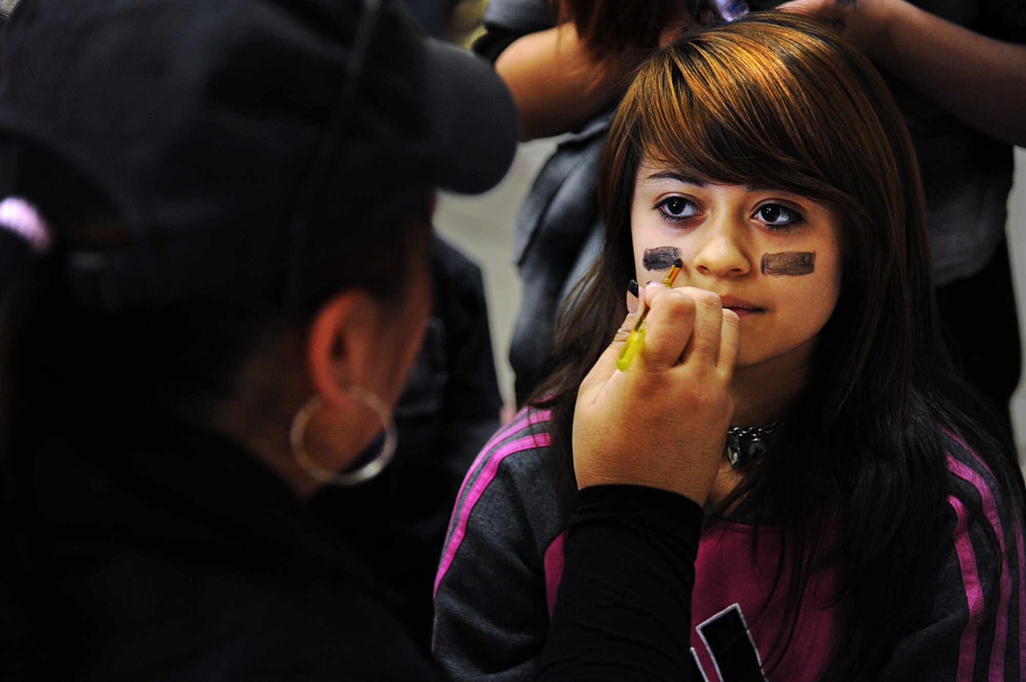 Texas native, Honesty Ureste, gets her face painted during the Fall Festival at Cannon Air Force Base, N.M., Oct. 27, 2012. With games, food and a live band, this event was popular for base families as more than 500 people joined in the festivities.  (U.S. Air Force photo/Senior Airman Jette Carr)