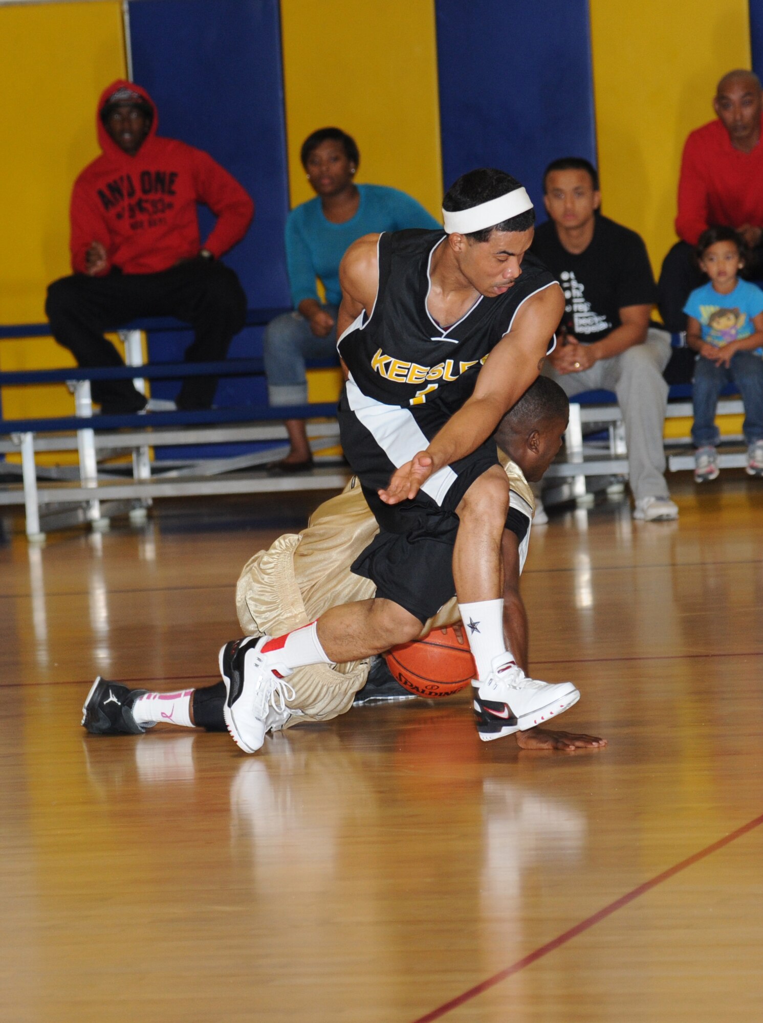 Mario McKnight, Keesler, tries to steal the ball causing Chris Saunders, Fort Benning, to lose control of the ball during a varsity basketball game Oct. 27, 2012, at the Blake Fitness Center, Keesler Air Force Base, Miss. Fort Benning defeated Keesler 78-76.  (U.S. Air Force photo by Kemberly Groue)