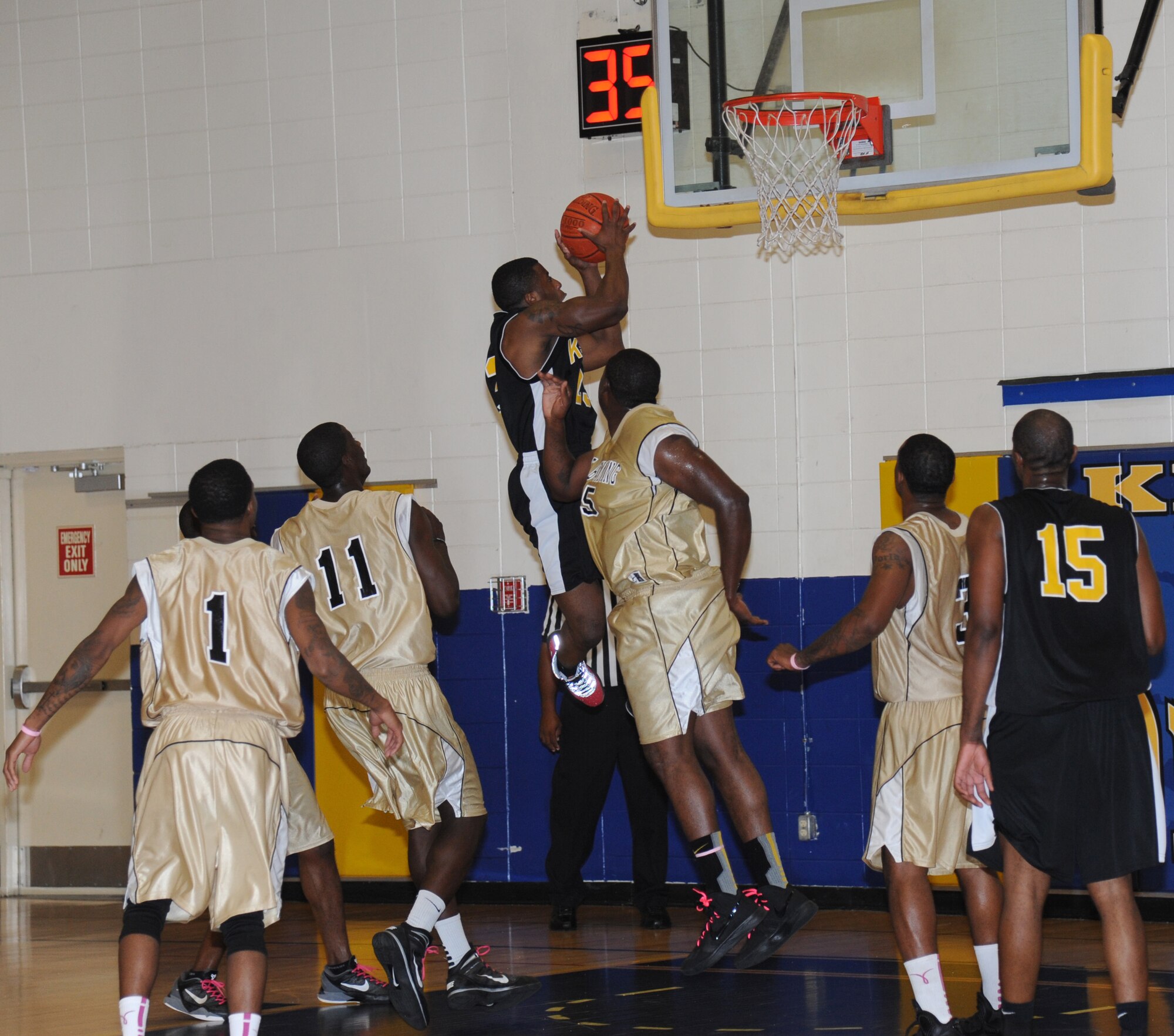 Justin Gachett, Keesler, leaps in the air for a 2-point shot during a varsity basketball game against Fort Benning Oct. 27, 2012, at the Blake Fitness Center, Keesler Air Force Base, Miss. Fort Benning defeated Keesler 78-76.  (U.S. Air Force photo by Kemberly Groue)