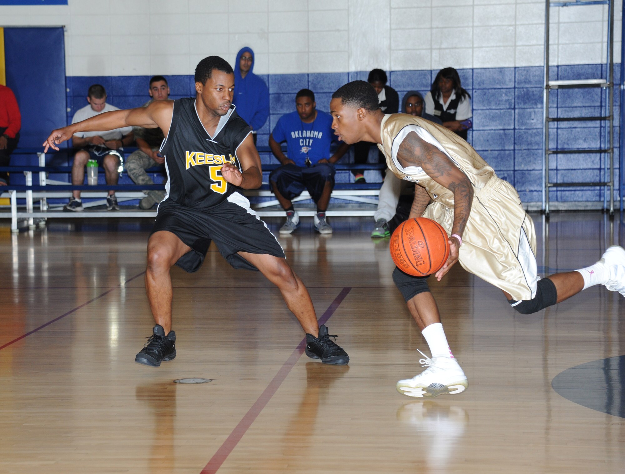 Devin Jacobs, Keesler, plays defense against Joshua Franklin, Fort Benning, as he drives the ball down the court during a varsity basketball game Oct. 27, 2012, at the Blake Fitness Center, Keesler Air Force Base, Miss. Fort Benning defeated Keesler 78-76.  (U.S. Air Force photo by Kemberly Groue)