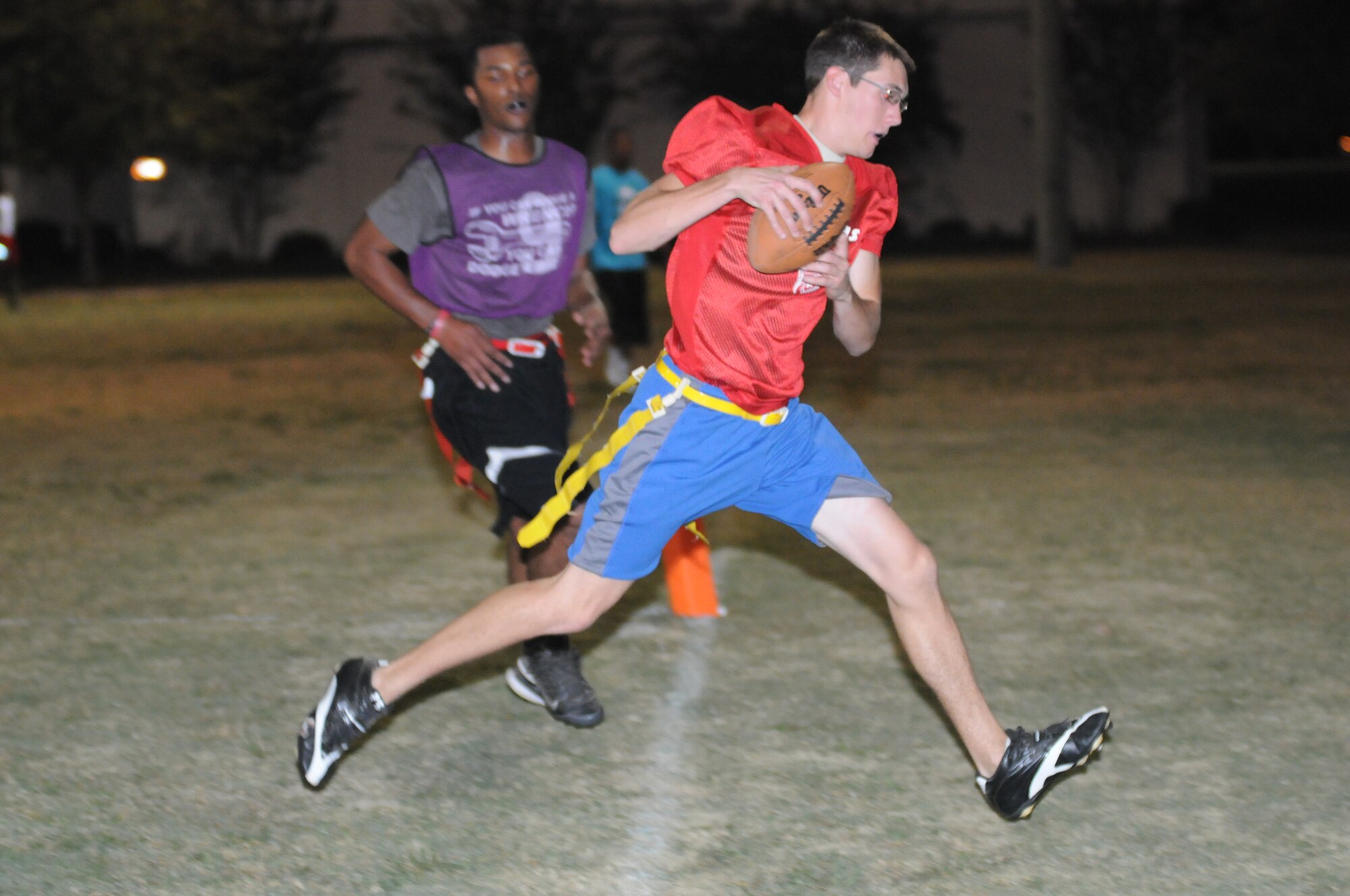Reshod Campbell, 403rd Wing, watches as Eric Roe, 333rd Training Squadron, attempted an interception before going out of bounds during an intramural flag football game Oct. 25, 2012, at Keesler Air Force Base, Miss. The 403rd Wing defeated the 333rd TRS, 33-20.  (U.S. Air Force photo by Kemberly Groue)