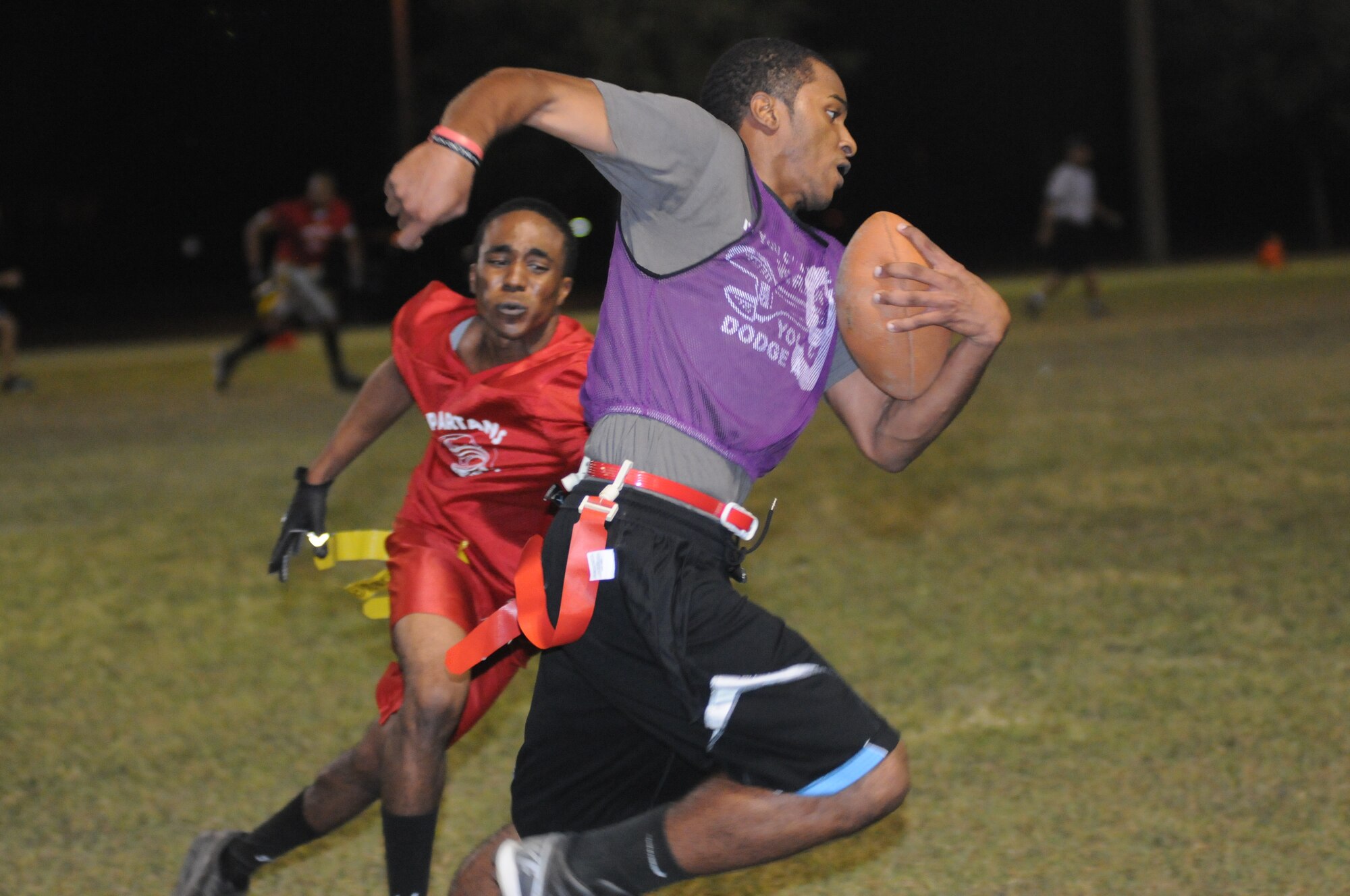 Mike War, 333rd Training Squadron, reaches for the flag attached to Reshod Campbell, 403rd Wing, as he sprints down the field during an intramural flag football game Oct. 25, 2012, at Keesler Air Force Base, Miss.  The 403rd Wing defeated the 333rd TRS, 33-20.  (U.S. Air Force photo by Kemberly Groue)
