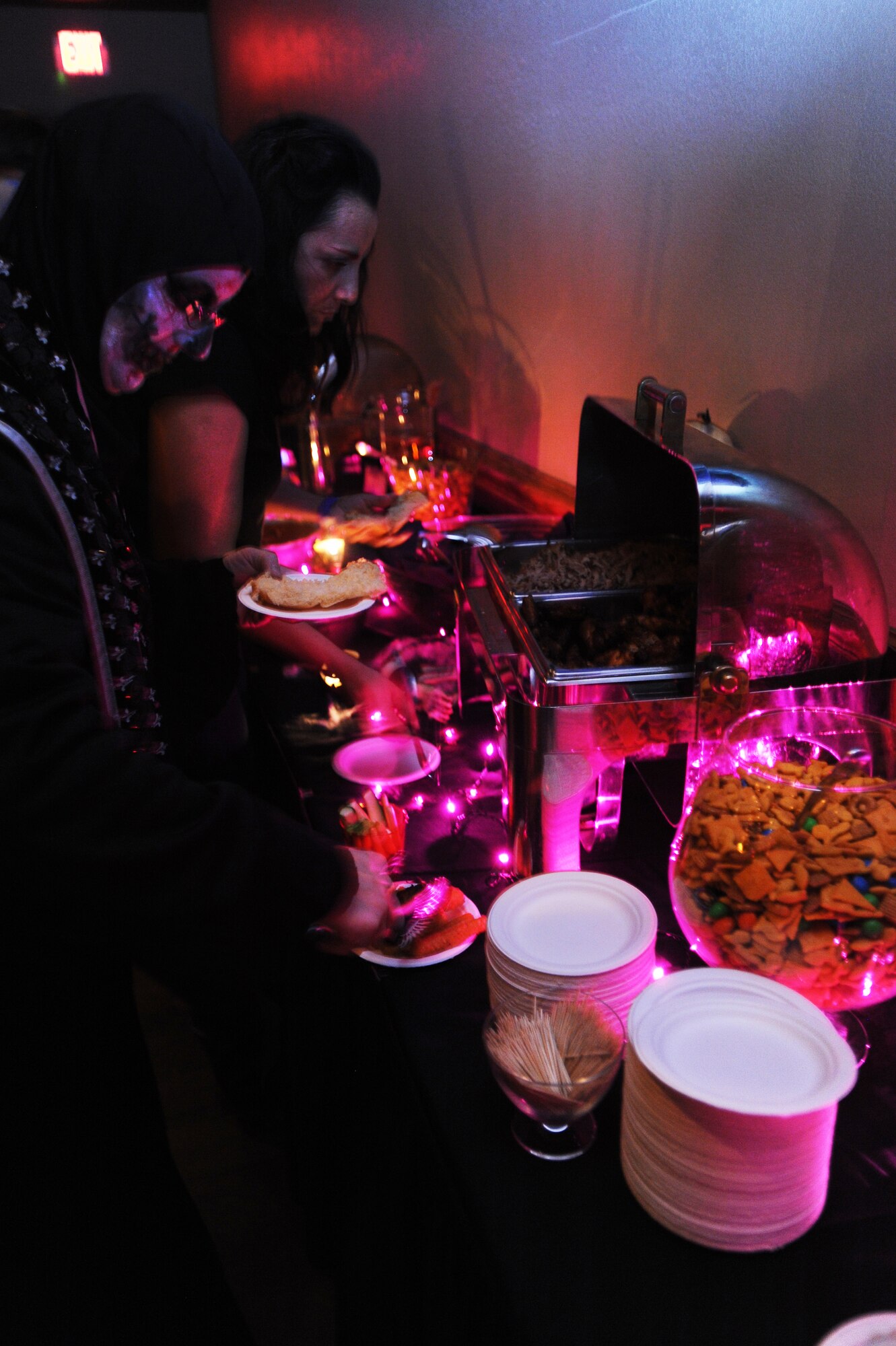 Air Commandos in costume dish-up food during the Mad Scientist Halloween Party at Cannon Air Force Base, N.M., Oct. 26, 2012.  This event was in celebration of the Landing Zone's renovated bar re-opening. (U.S. Air Force photo/Senior Airman Jette Carr)