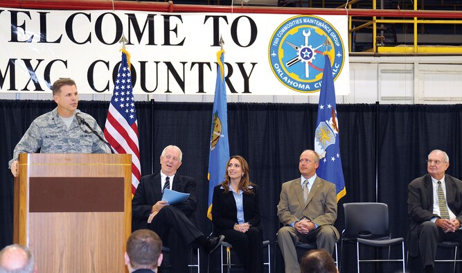 During the Oct. 16 Brownfields ceremony in Bldg. 9001, Col. Steven Bleymaier, 72nd Air Base Wing and Tinker installation commander, talks about Tinker’s continuing transformation of the old General Motors plant into a humming Air Force maintenance facility. The commander accepted a Brownfields “No Action Necessary” certificate from the state Department of Environmental Quality recognizing Tinker’s cleanup and redevelopment of the area, thereby avoiding any negative environmental actions. Seated from left are Steven Thompson, executive director, Department of Environmental Quality; Amber Perry, Environmental Protection Agency; Oklahoma County Commissioner Brian Maughan; and Gary Pence, Oklahoma City Chamber of Commerce. (Air Force photo by Margo Wright)
