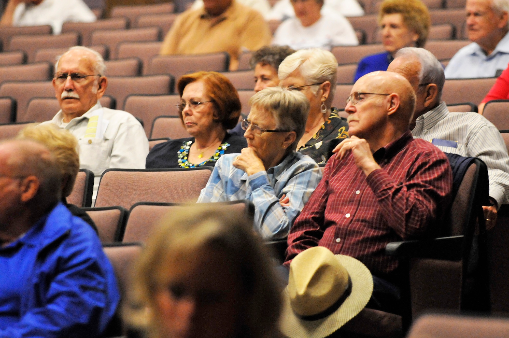Retirees listen to briefings at the base theater during Robins’ Retiree Appreciation Day Saturday. The appreciation day was to inform, assist and honor all retired military members, spouses and surviving spouses, and their family members with base access. (U. S. Air Force photo/Sue Sapp)