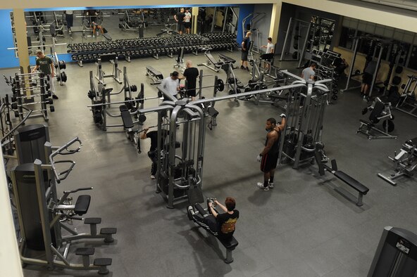 Patrons of the Barksdale Fitness Center exercise on Barksdale Air Force Base, La., Oct. 25. The Fitness Center is open from 4 a.m. to midnight on weekdays and 8 a.m. to 6 p.m. on weekends.  Approximately 8,000 Airmen, dependents and retirees use the facility each week. (U.S. Air Force photo/Senior Airman Micaiah Anthony)(RELEASED)