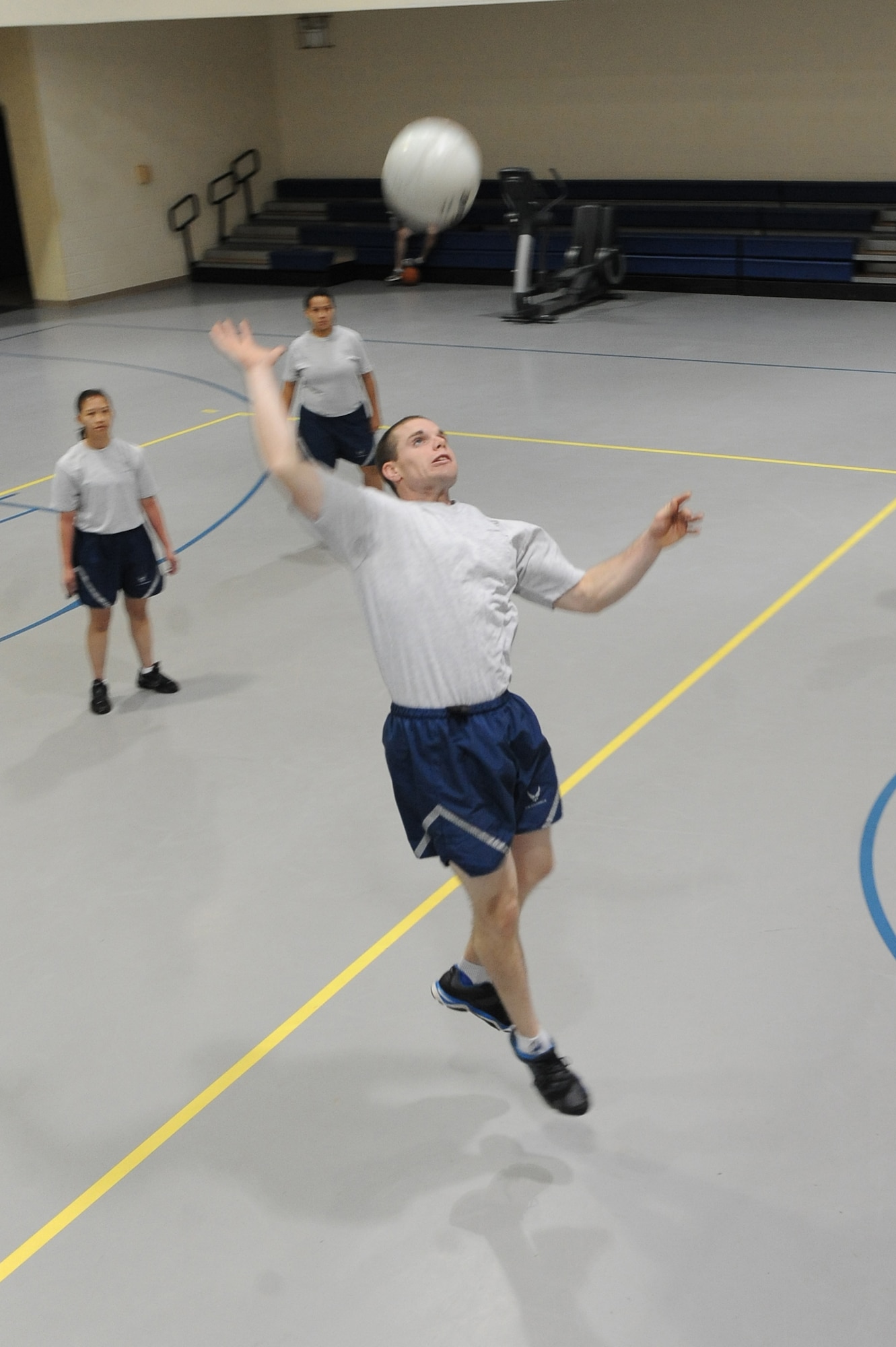 An Airman from the 2nd Comptroller Squadron jumps to hit a volleyball in the Fitness Center on Barksdale Air Force Base, La., Oct. 25. Many units around base meet at the gym for physical training. The Fitness Center offers a variety of sports for Airmen to play such as football, softball, dodgeball, walleyball, basketball, racquetball, kickball and volleyball. (U.S. Air Force photo/Senior Airman Micaiah Anthony)(RELEASED)
