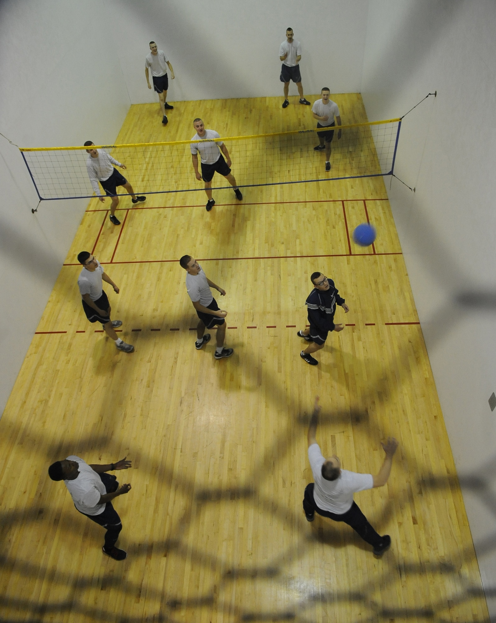 Airmen from the 2nd Communication Squadron play walleyball in the Fitness Center on Barksdale Air Force Base, La., Oct. 25. Many units around base meet at the gym for physical training. The Fitness Center offers a variety of sports for Airmen to play such as football, softball, dodgeball, walleyball, basketball, racquetball, kickball and volleyball. (U.S. Air Force photo/Senior Airman Micaiah Anthony)(RELEASED)