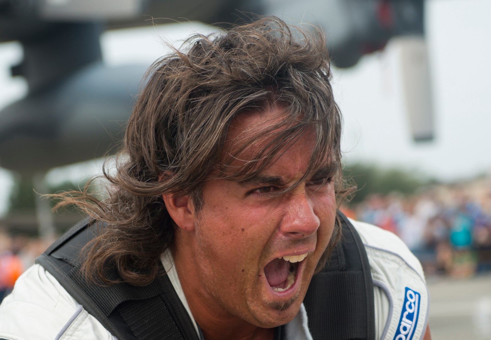 Mark Kirsch, strong man for "Man vs. Jumbo Jets", yells as he pulls an HC-130P Combat King during the Moody Air Force Base, Ga., Legacy of Liberty Open House air show Oct. 27, 2012. Kirsch is known for pulling various objects that weigh more than 75,000 pounds. (U.S. Air Force photo by Senior Airman Douglas Ellis/Released)
