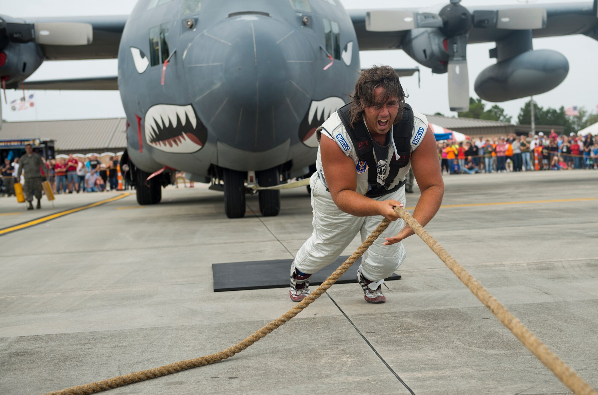 Mark Kirsch, strong man for "Man vs. Jumbo Jets", pulls an HC-130P Combat King during the Moody Air Force Base, Ga., Legacy of Liberty Open House air show Oct. 27, 2012. Kirsch is known for pulling various objects that weigh more than 75,000 pounds. (U.S. Air Force photo by Senior Airman Douglas Ellis/Released)
