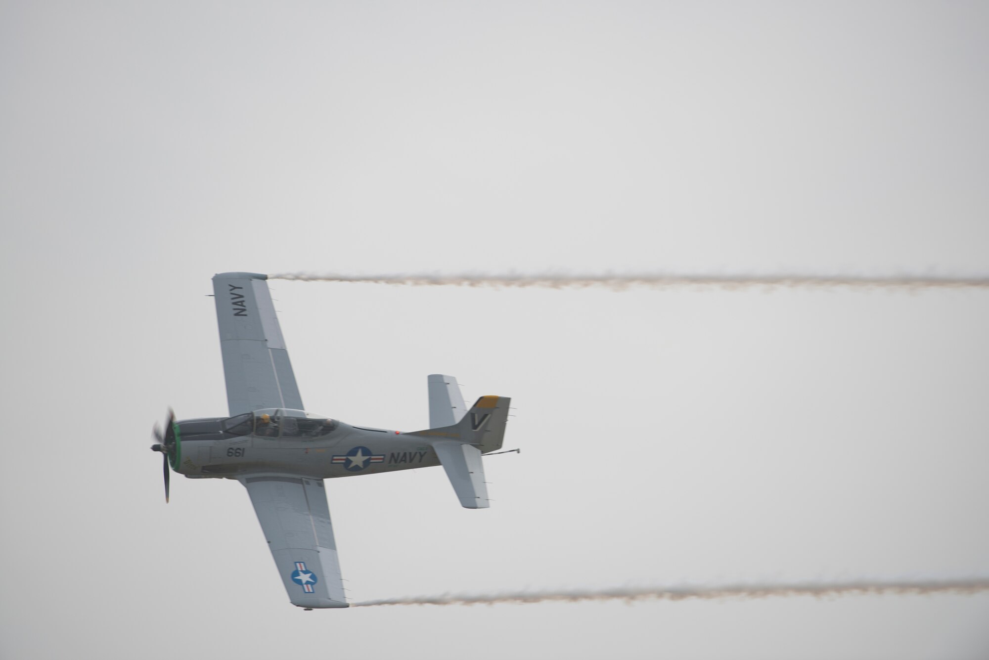 Herb and Ditto and their T-28 fly overhead during the Moody Air Force Base, Ga., Legacy of Liberty Open House air show Oct. 27, 2012. The T-28 performed an aerobatic demonstration at speeds greater than 350 mph. (U.S. Air Force photo by Senior Airman Douglas Ellis/Released)
