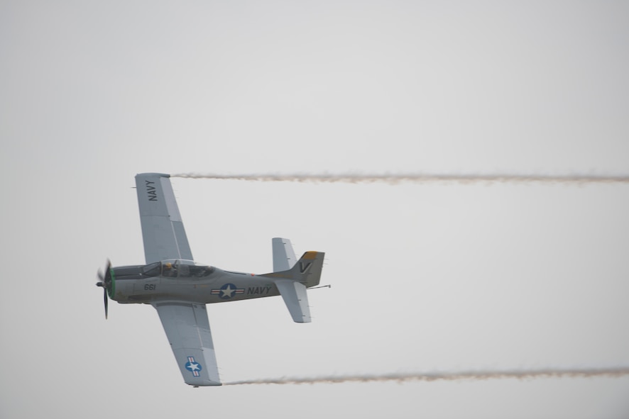 Herb and Ditto and their T-28 fly overhead during the Moody Air Force Base, Ga., Legacy of Liberty Open House air show Oct. 27, 2012. The T-28 performed an aerobatic demonstration at speeds greater than 350 mph. (U.S. Air Force photo by Senior Airman Douglas Ellis/Released)
