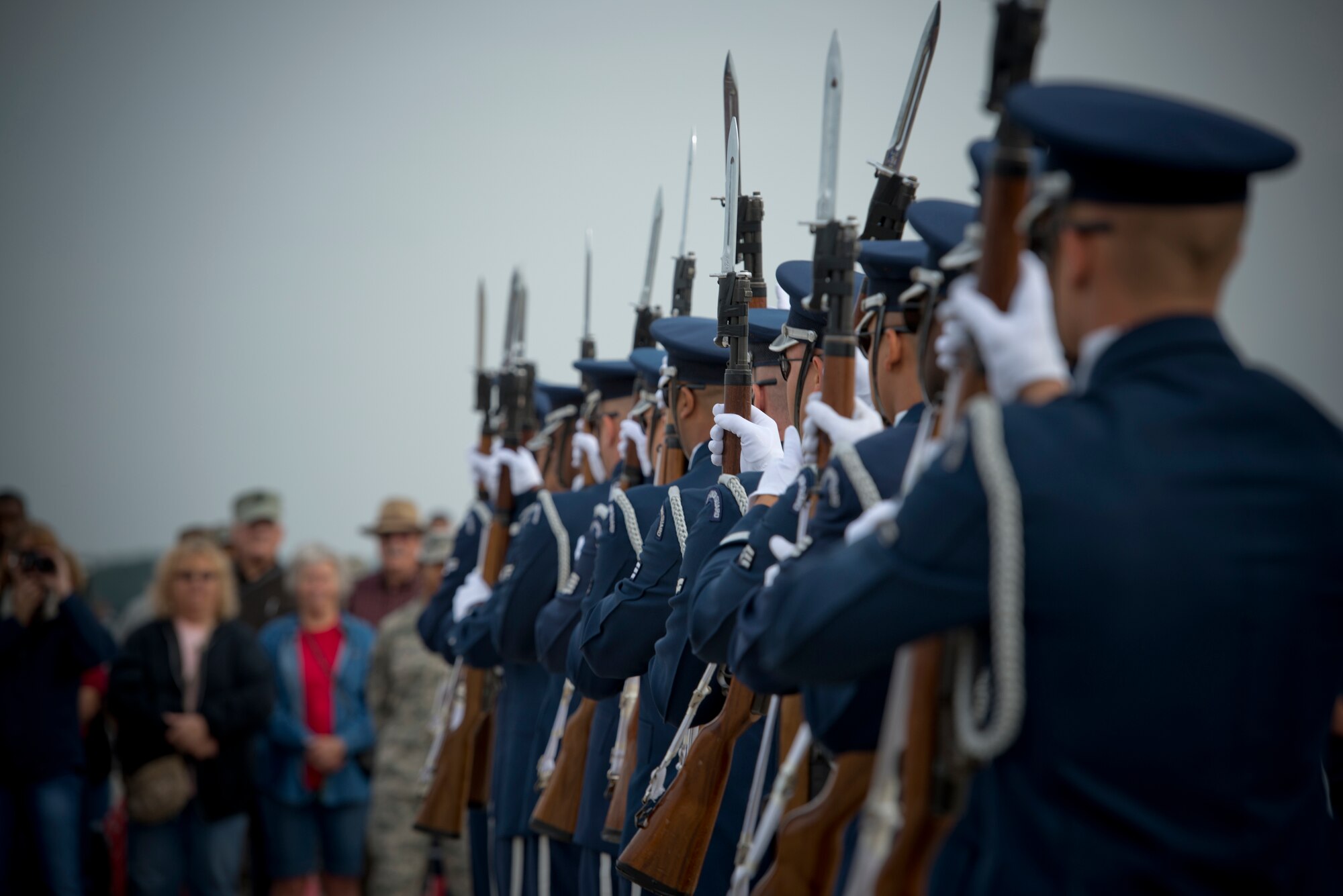 Members of the U.S. Air Force Honor Guard Drill Team perform during the Moody Air Force Base, Ga., Legacy of Liberty Open House air show Oct. 27, 2012. An audience watched as the team executed its act at center stage. (U.S. Air Force photo by Senior Airman Douglas Ellis/Released)
