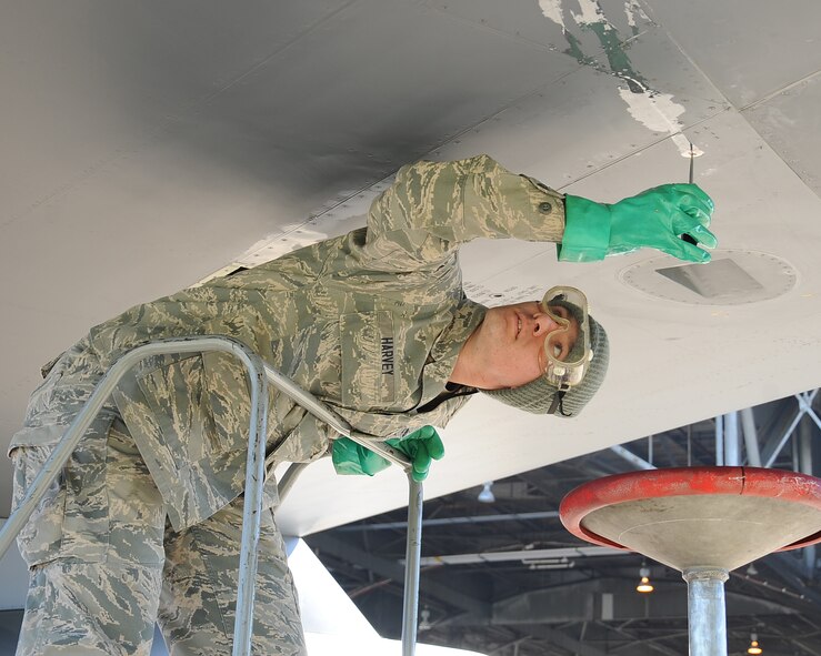 Airman 1st Class Kyle Harvey, 2nd Maintenance Squadron crew chief, tightens a fuel panel on a B-52H Stratofortress on Barksdale Air Force Base, La., Oct. 29. This process is done to remove the remaining fuel inside the aircraft in order to prevent it from venting out onto the ground. (U.S. Air Force photo/Senior Airman Sean Martin)(RELEASED)