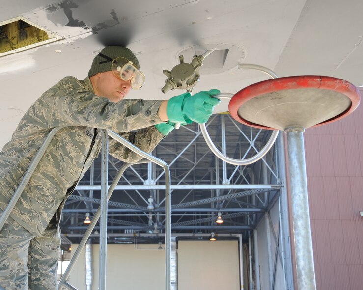 Airman 1st Class Kyle Harvey, 2nd Maintenance Squadron crew chief, drains a surge tank on a B-52H Stratofortress on Barksdale Air Force Base, La., Oct. 29. This process is done to remove the remaining fuel inside the aircraft in order to prevent it from venting out onto the ground. The B-52 has a fuel capacity of 312,197 lbs. (U.S. Air Force photo/Senior Airman Sean Martin)(RELEASED)