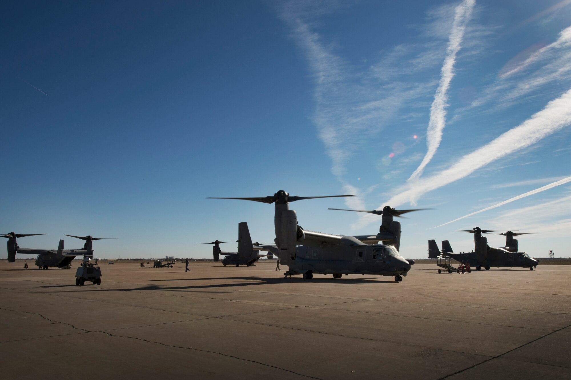 Aircrews of the CV-22 Osprey standby as they await the arrival of eager Air Commando spouses at Cannon Air Force Base, N.M., Oct. 27, 2012. Cannon's annual Spouses Orientation Flights offer a rare opportunity for husbands and wives to take to the skies in a military aircraft. (U.S. Air Force photo/Staff Sgt. Matthew Plew)